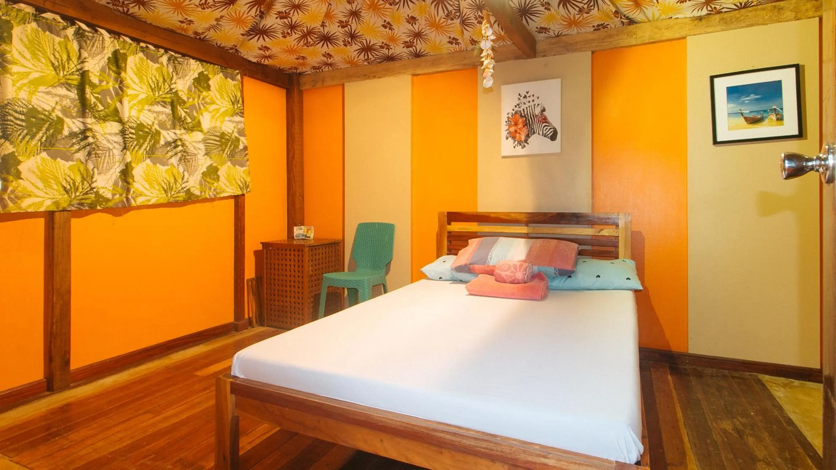 Bed in The Clara Beach and Guest House