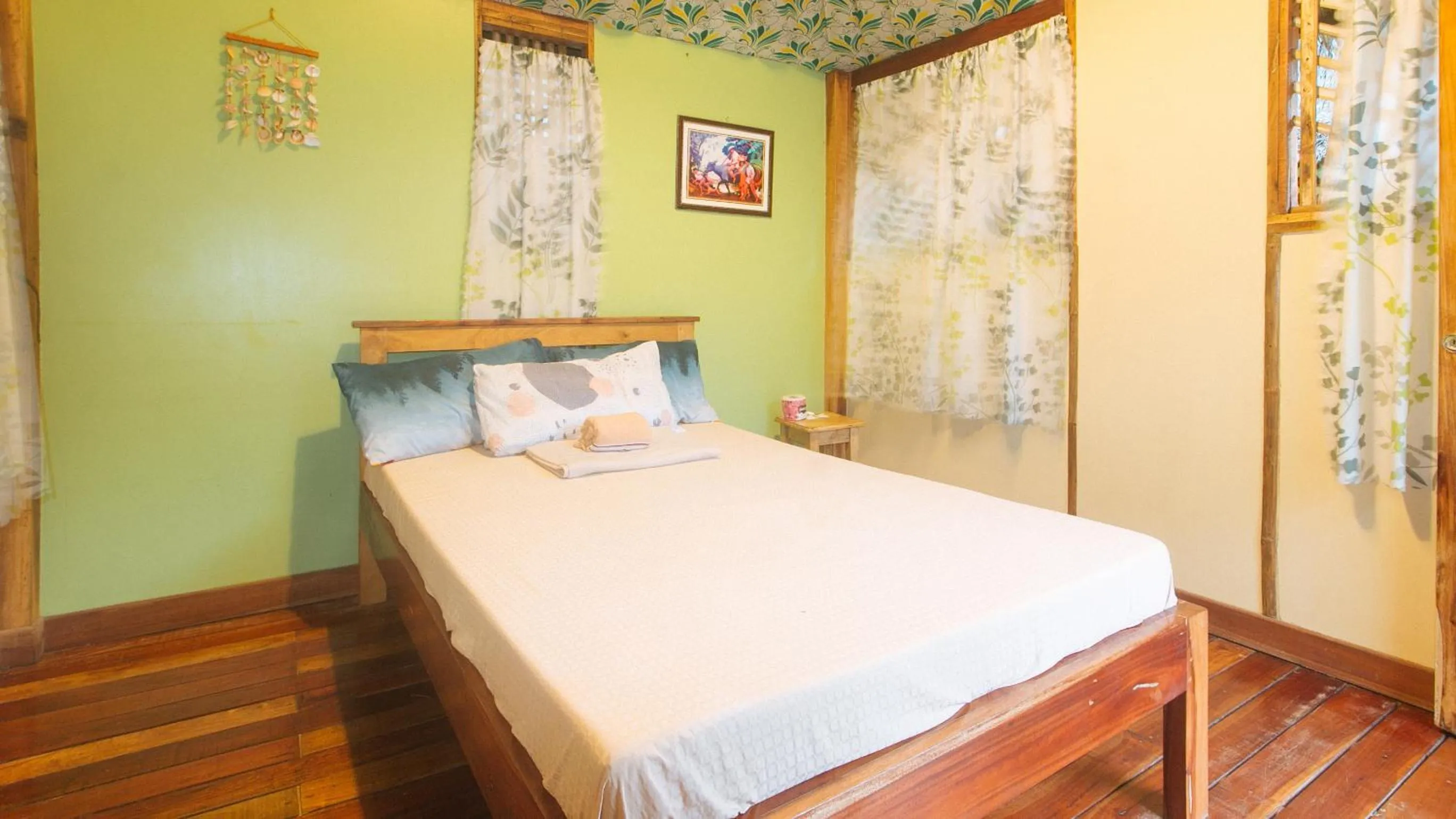 Bed in The Clara Beach and Guest House