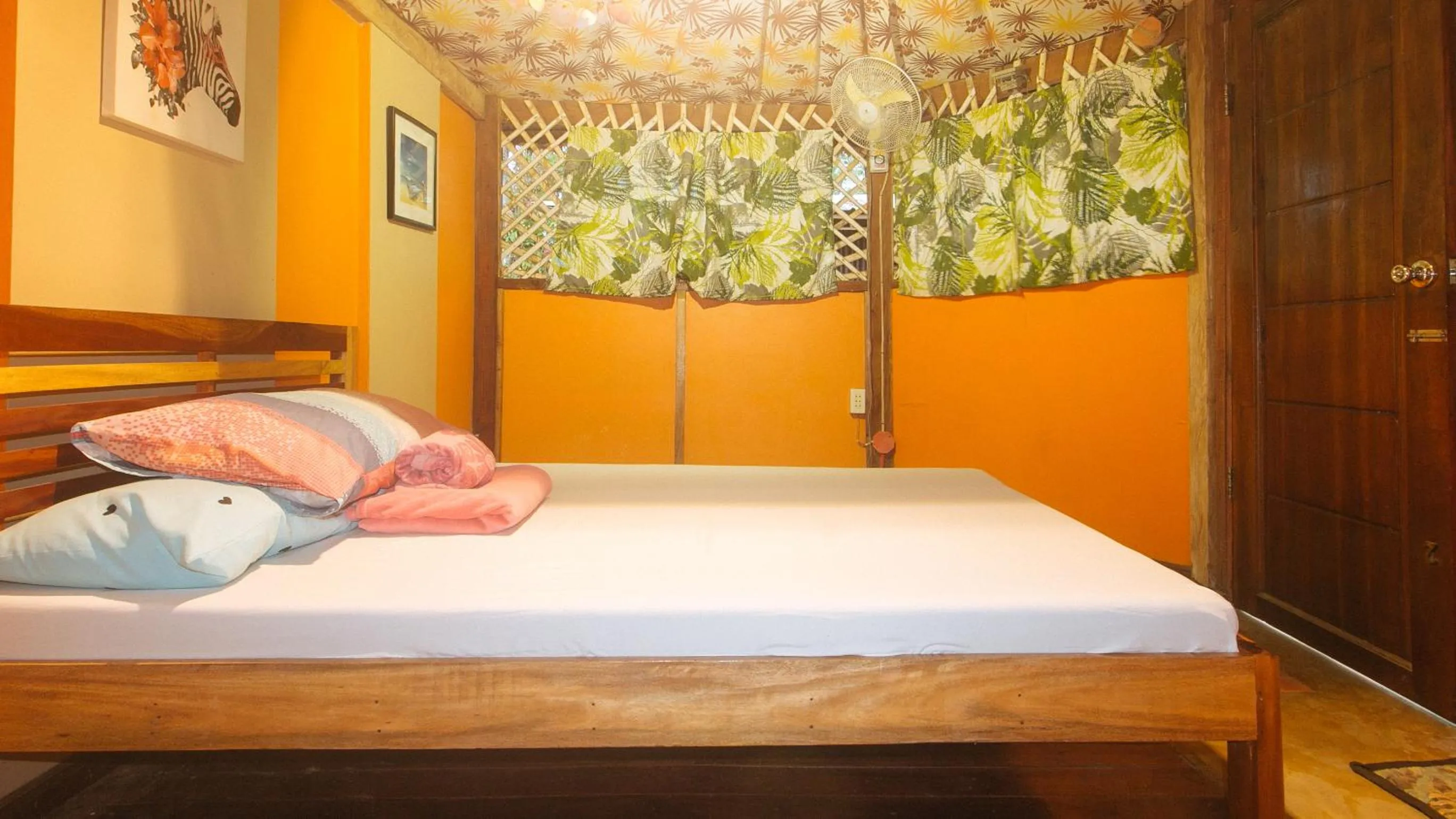 Bed in The Clara Beach and Guest House