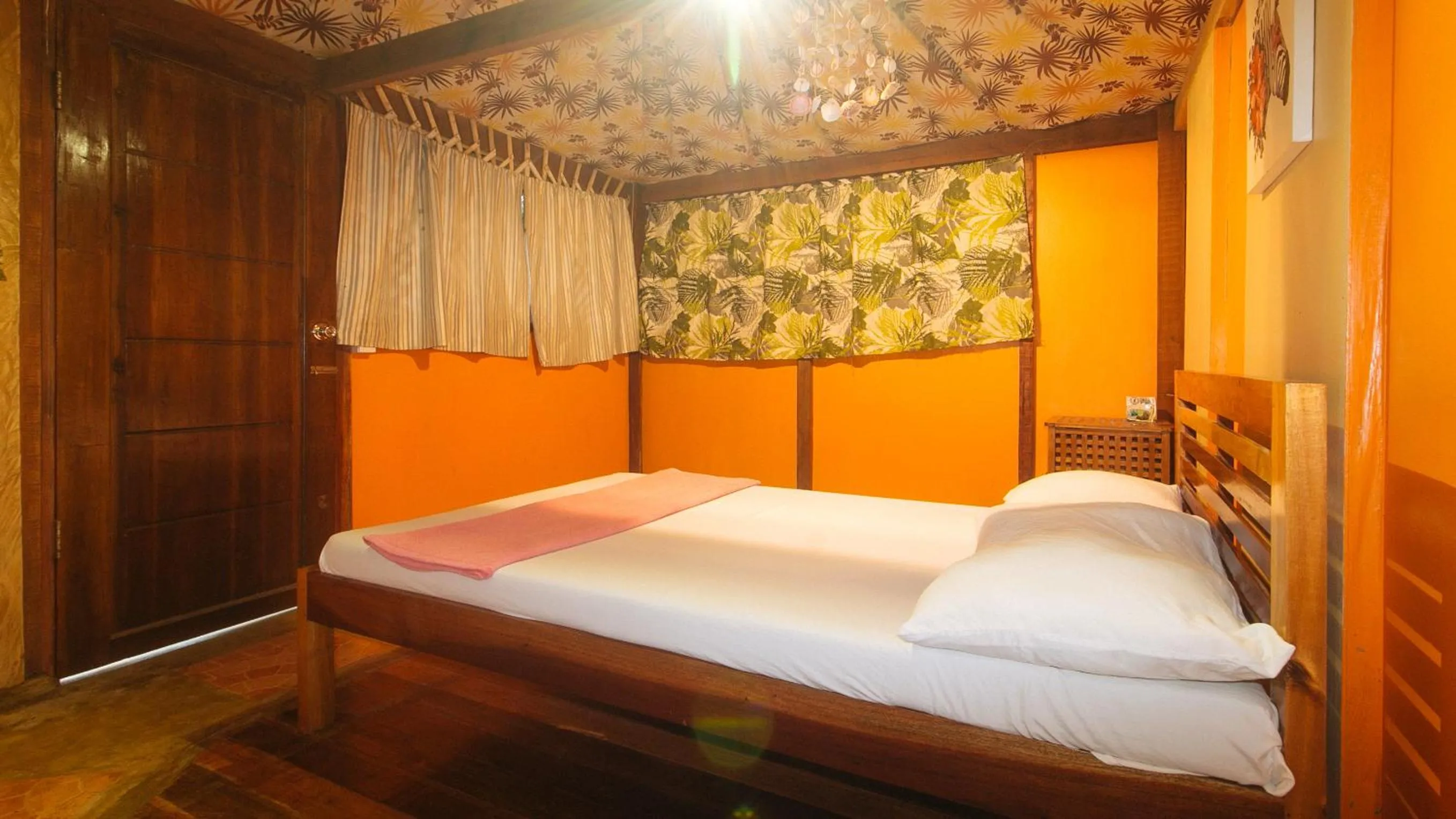 Bed in The Clara Beach and Guest House