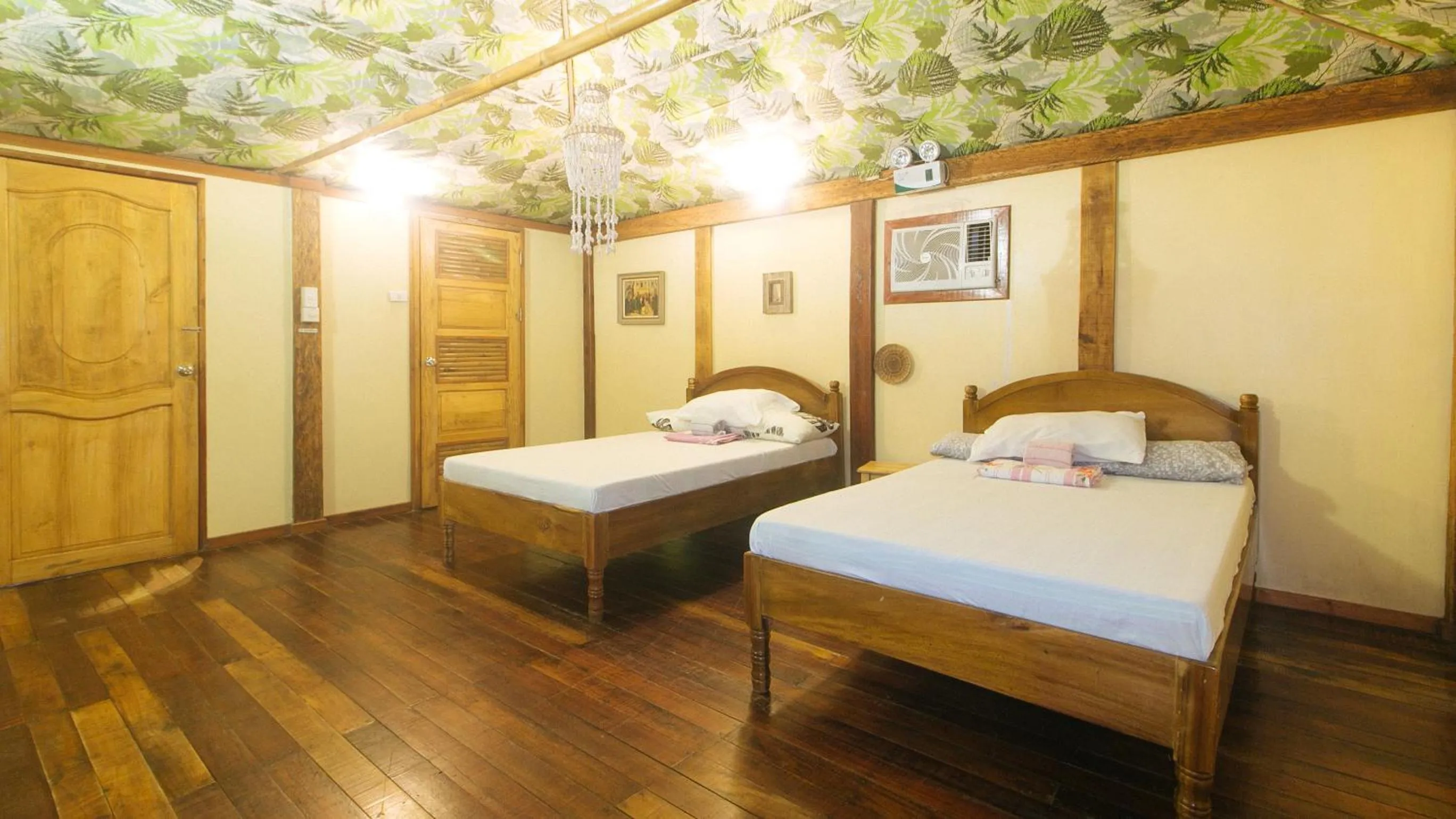 Bed in The Clara Beach and Guest House