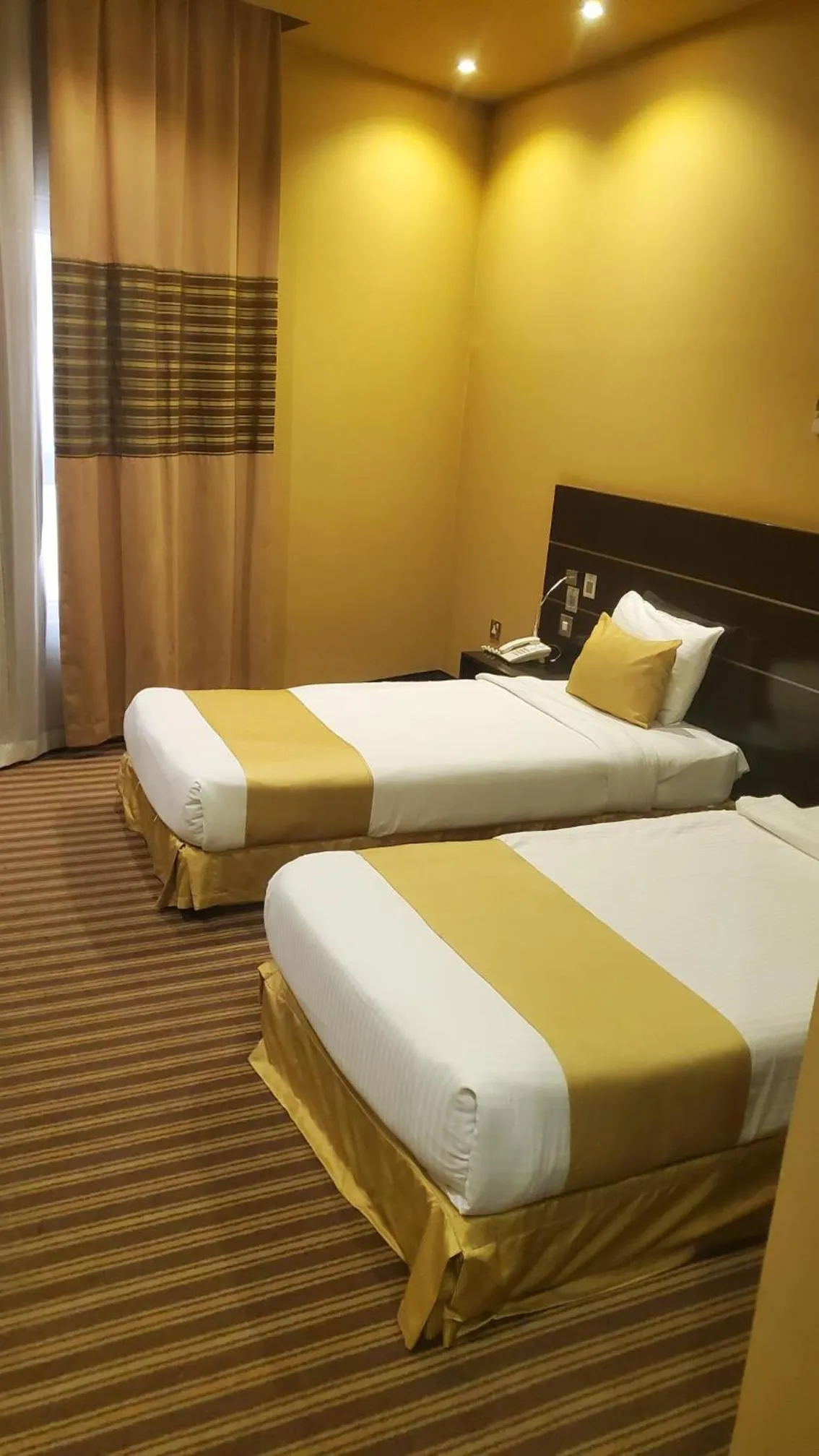Bed in Aldar Hotel