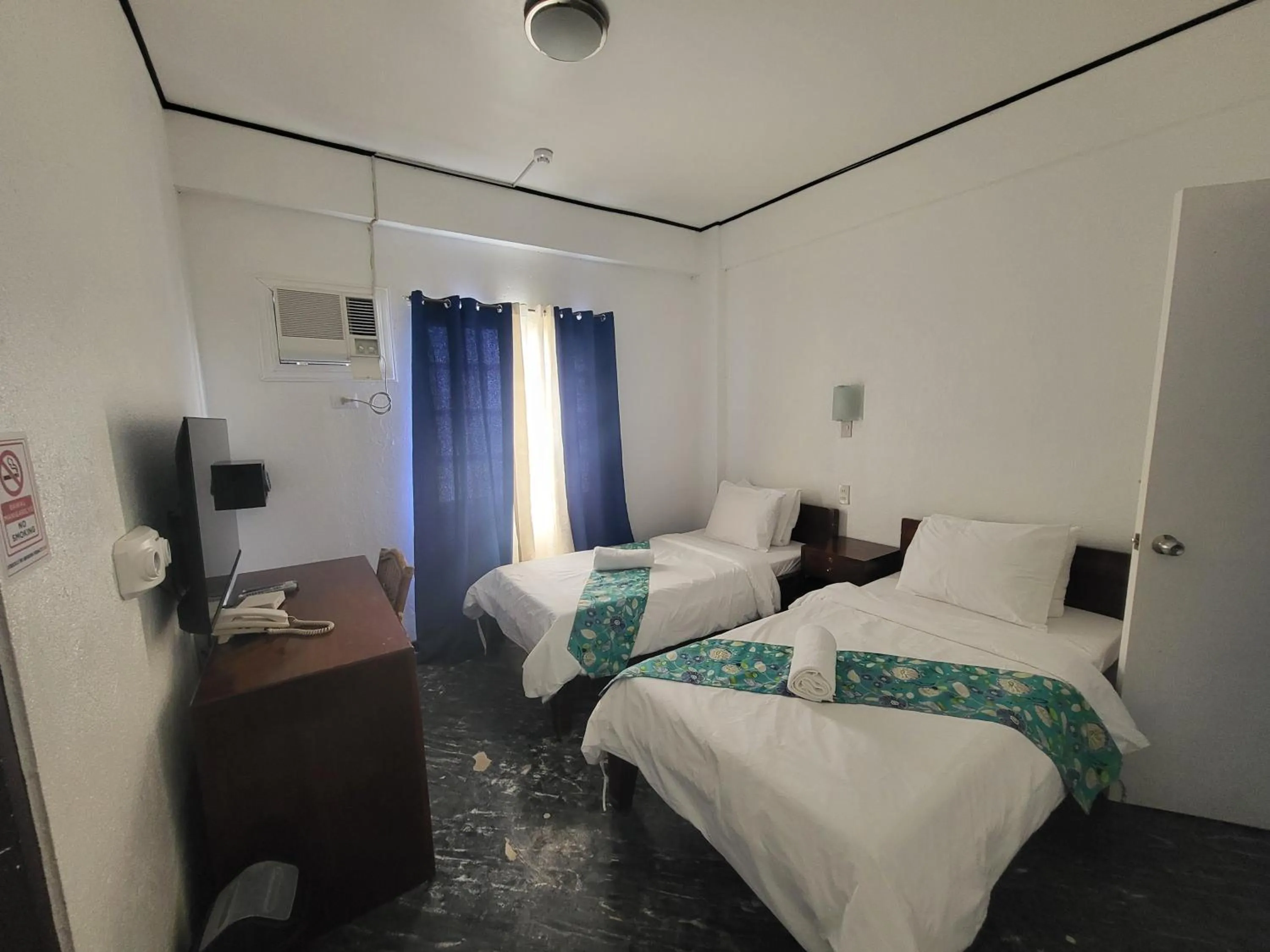 Bed in Sunvilla beachfront hotel