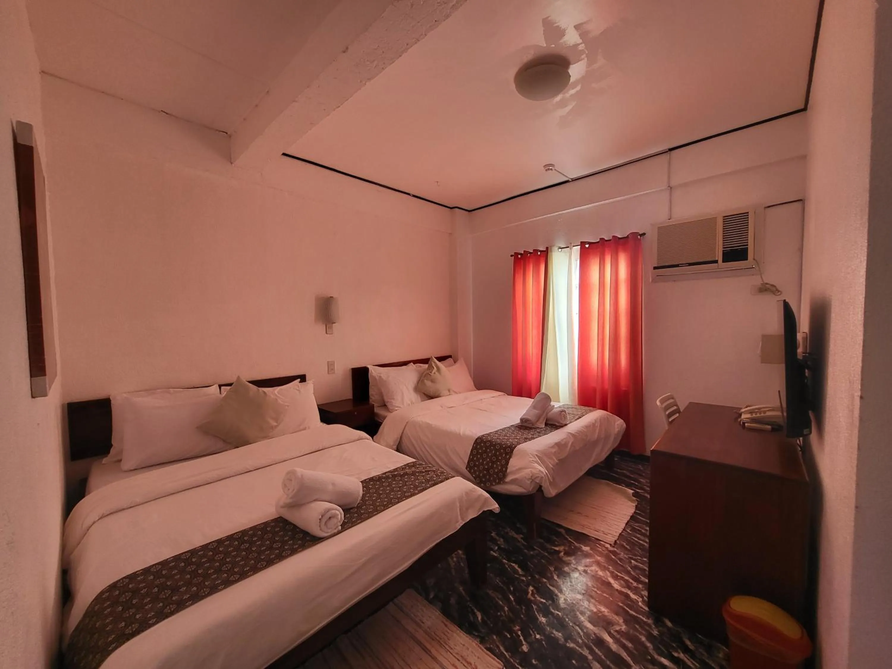 Bed in Sunvilla beachfront hotel