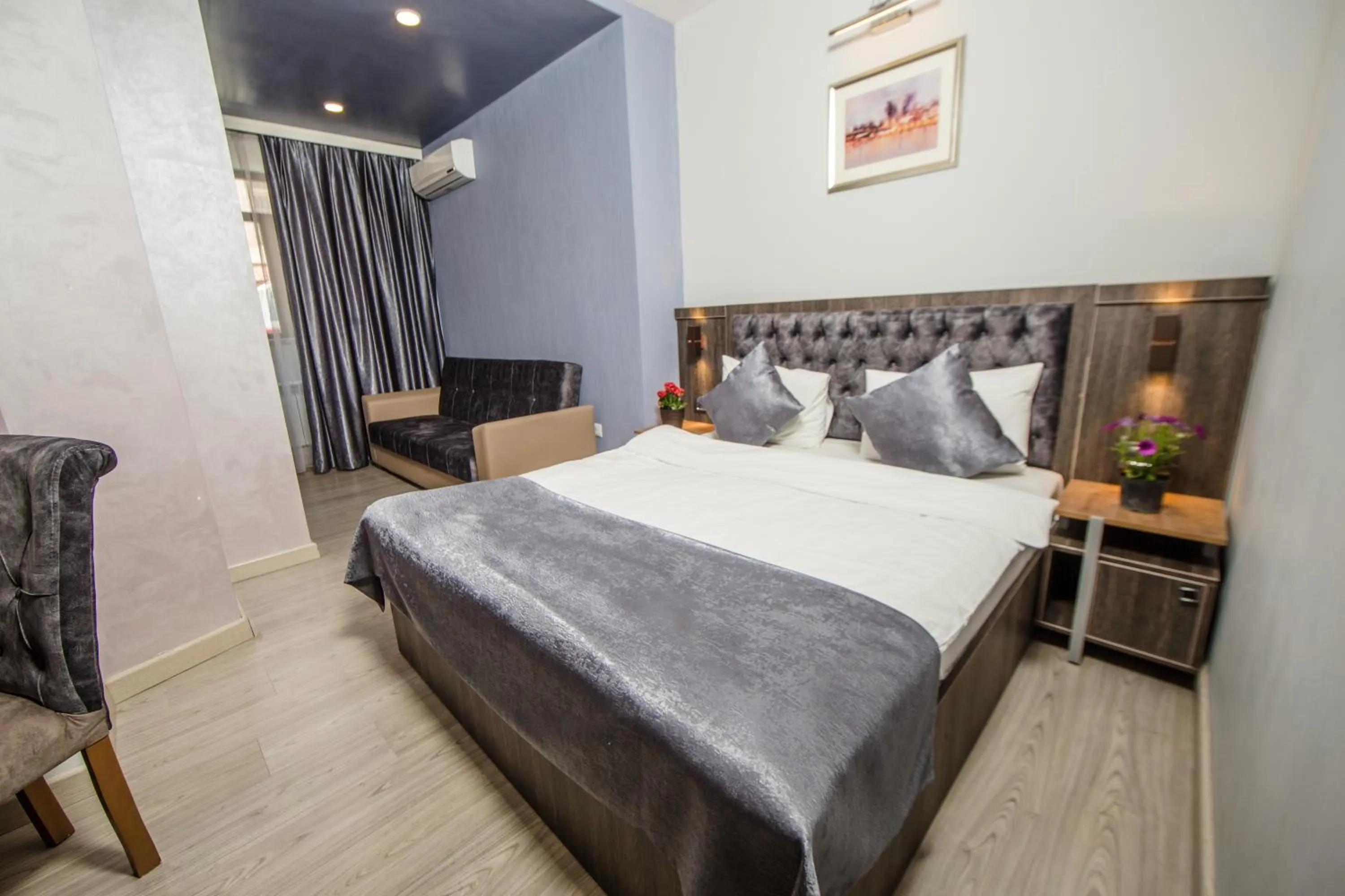 Living room, Bed in Passage Modern Hotel