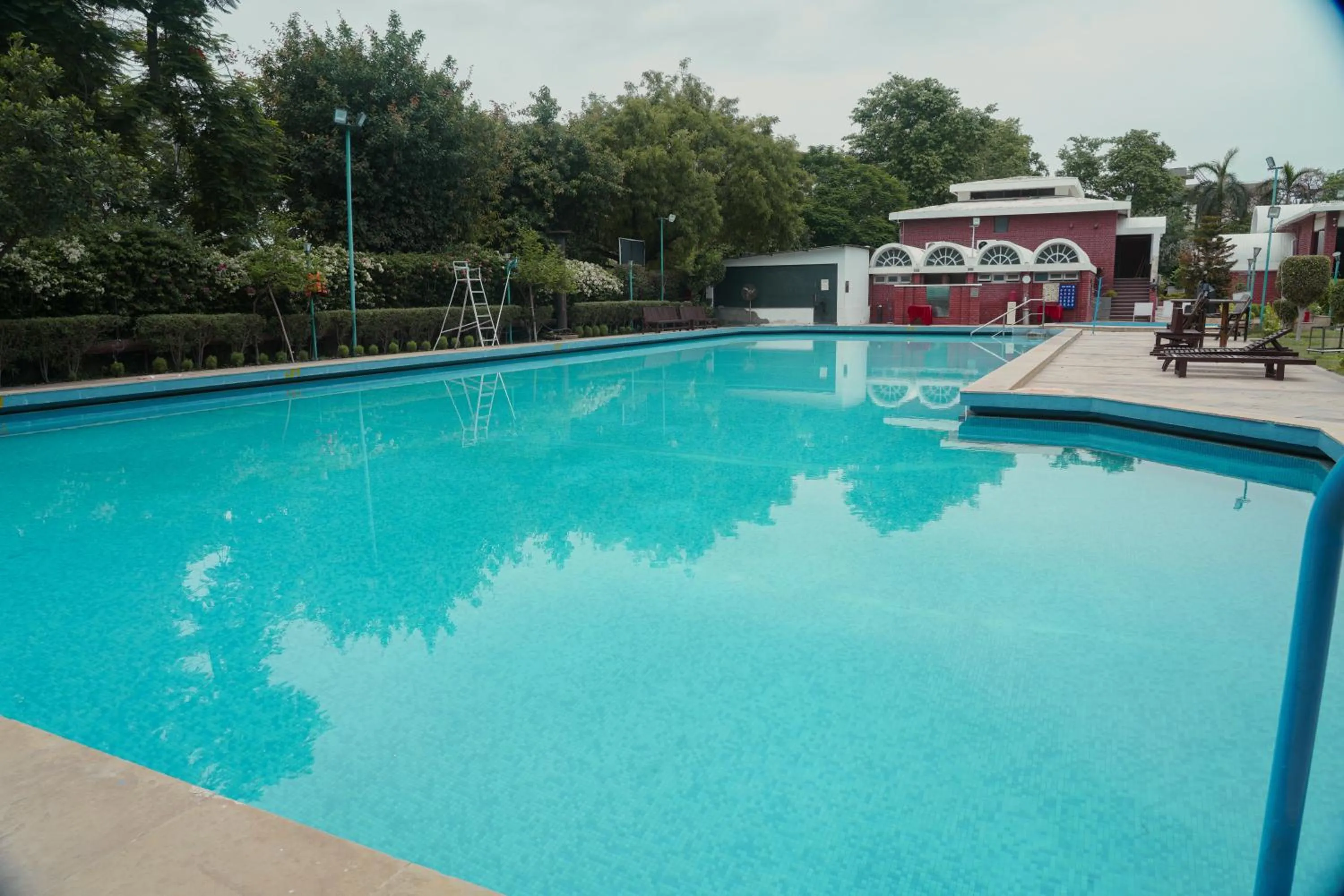 Swimming pool in Goa Country Club By Pearl Near Udyog vihar Yashobhoomi