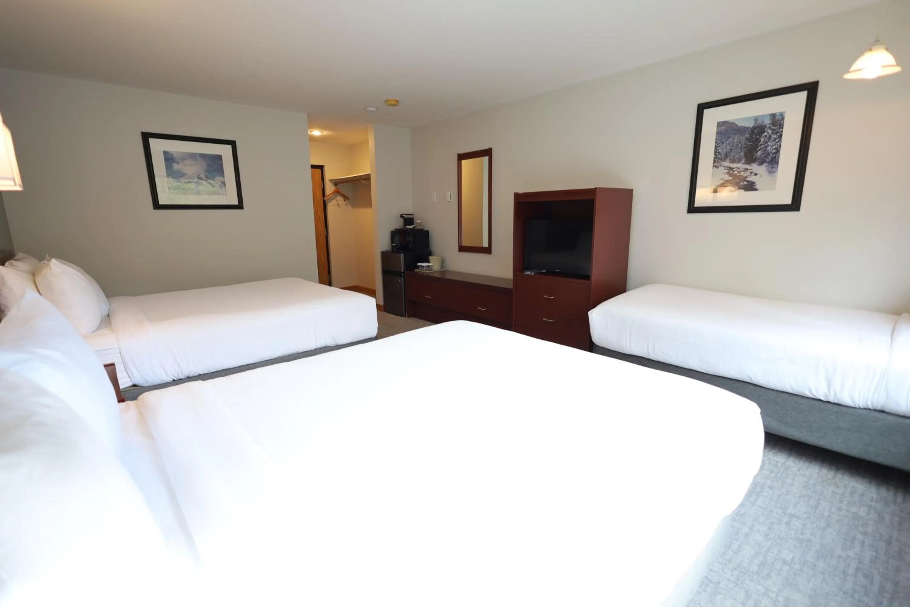 Bed in Glacier Mountain Lodge