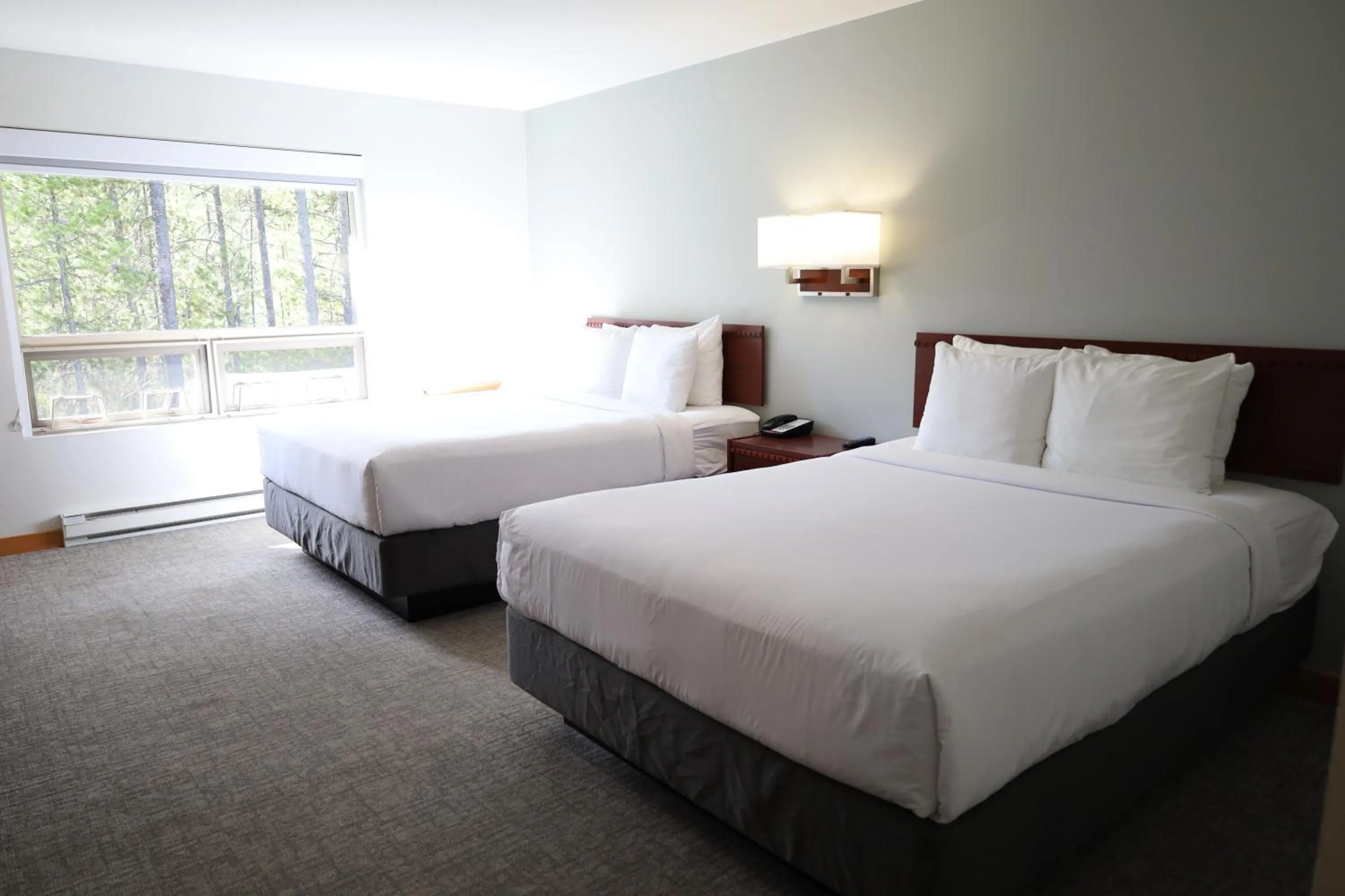 Bed in Glacier Mountain Lodge