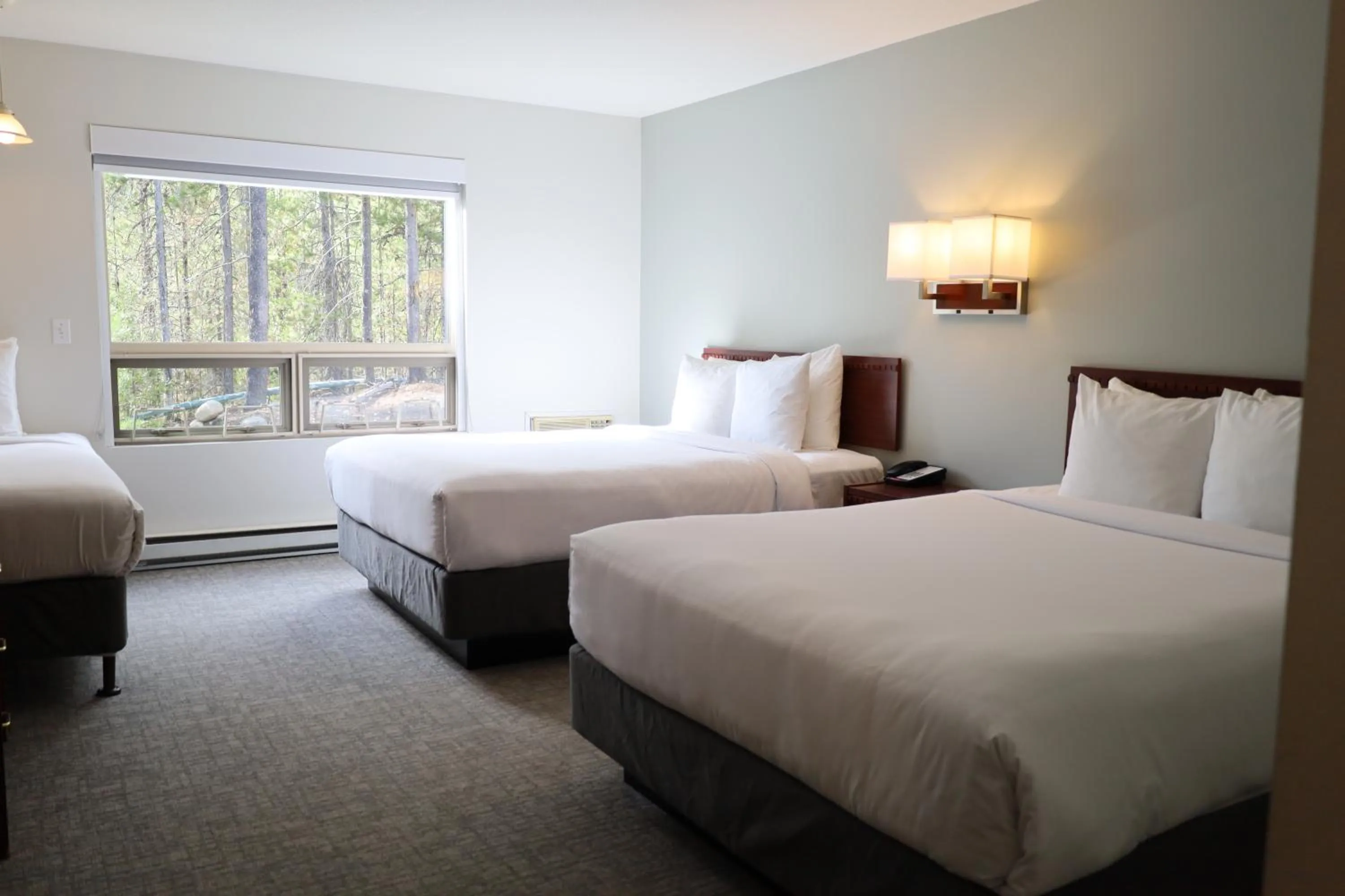 Bed in Glacier Mountain Lodge