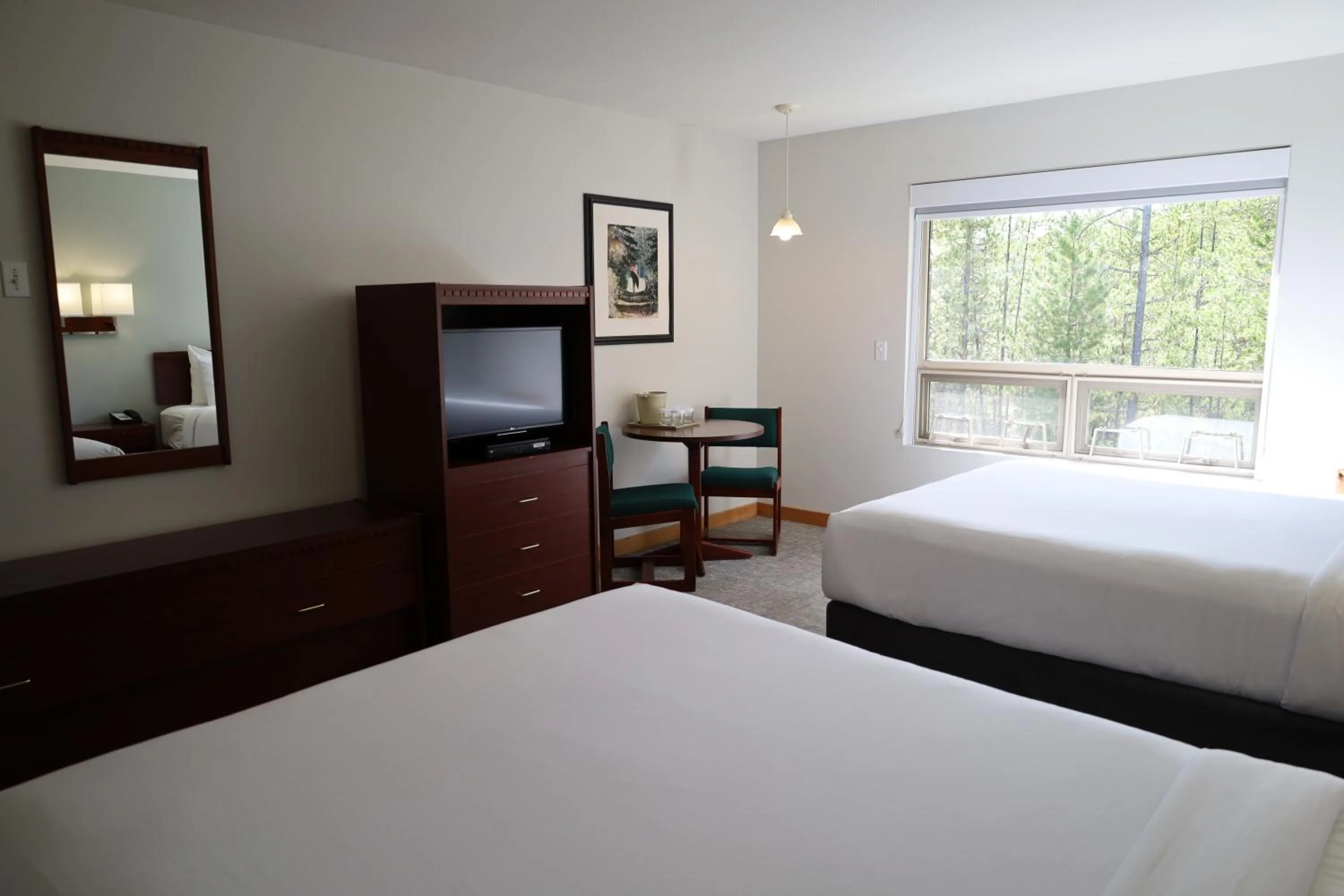 Bed in Glacier Mountain Lodge