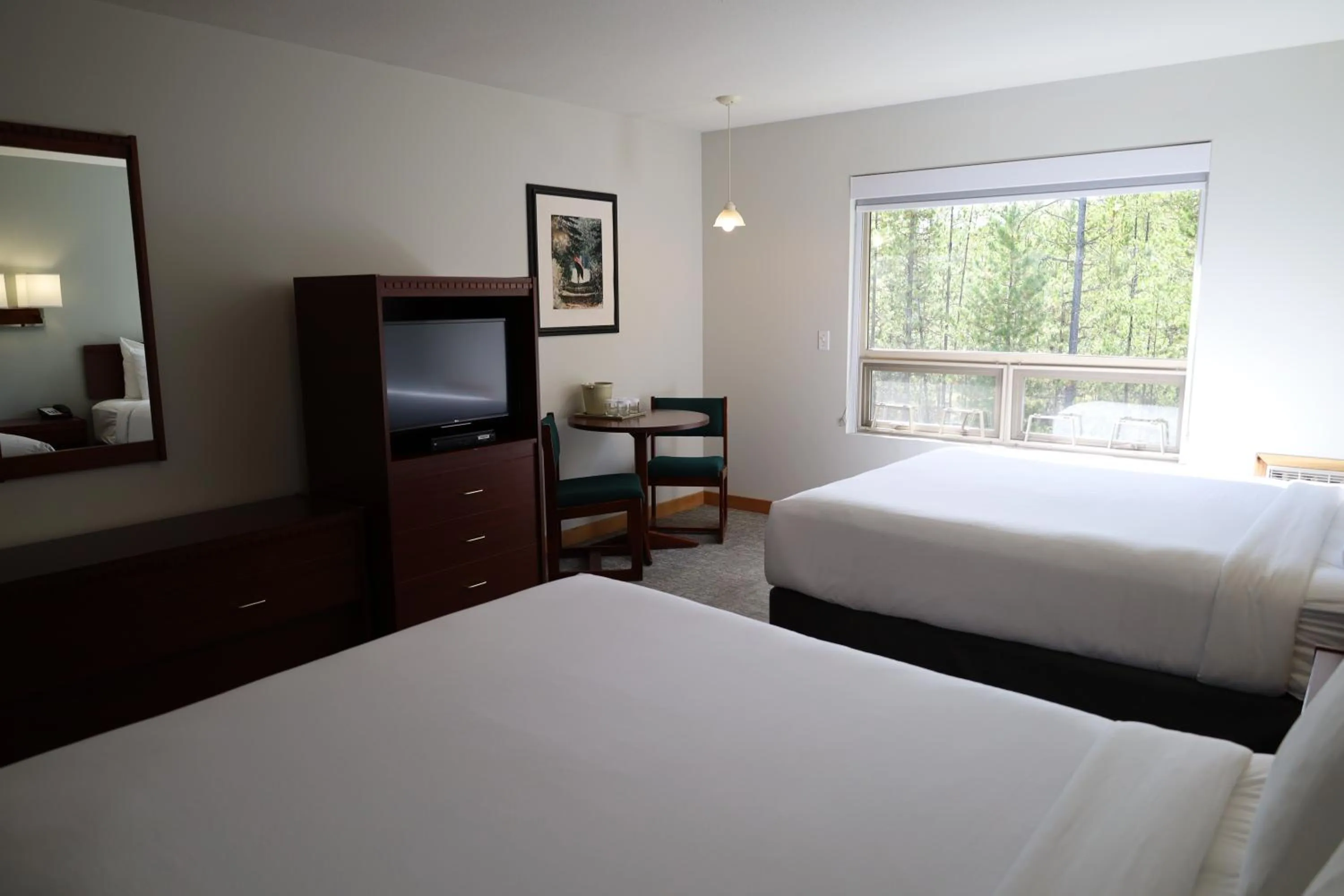 Bed in Glacier Mountain Lodge