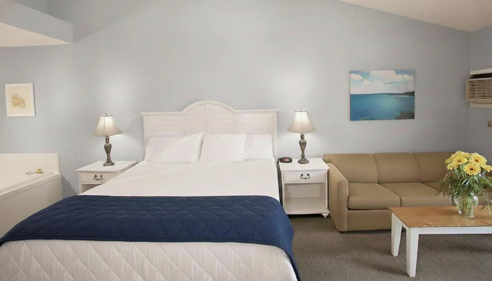 Bed in Pointes North Beachfront Hotel - 2 Person Spa Tub Studios