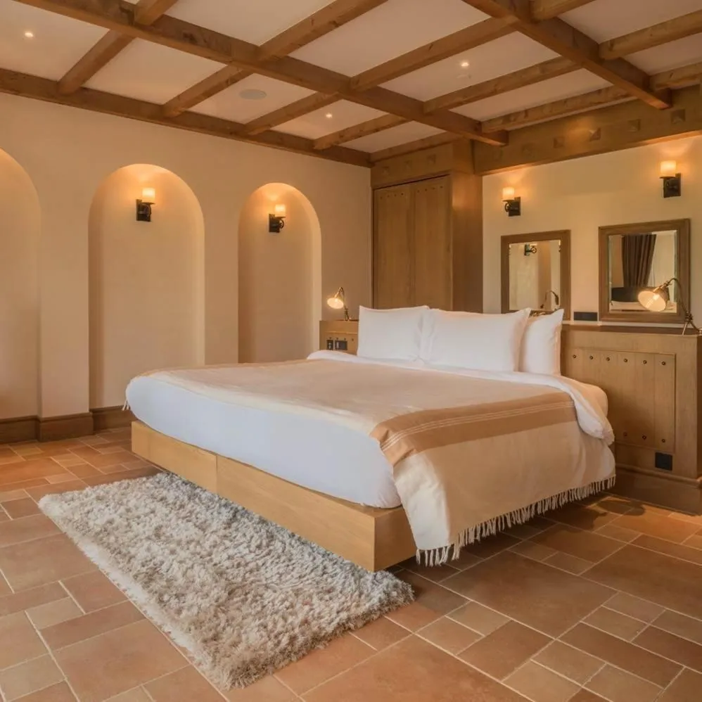 Bed in Toscana Town Square Suites