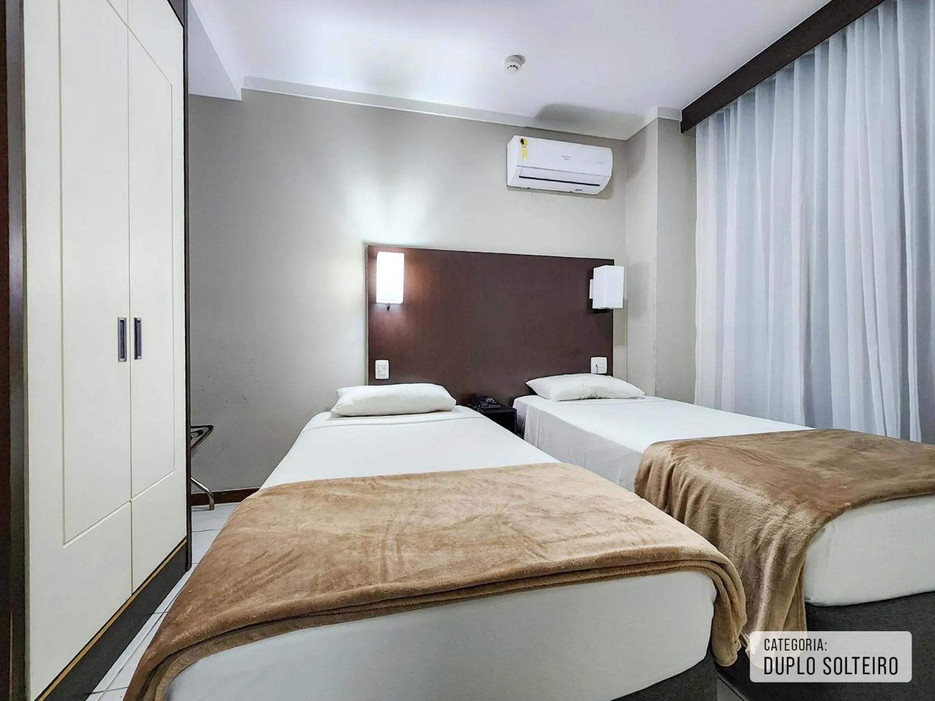 Bed in Triângulo Apart Hotel