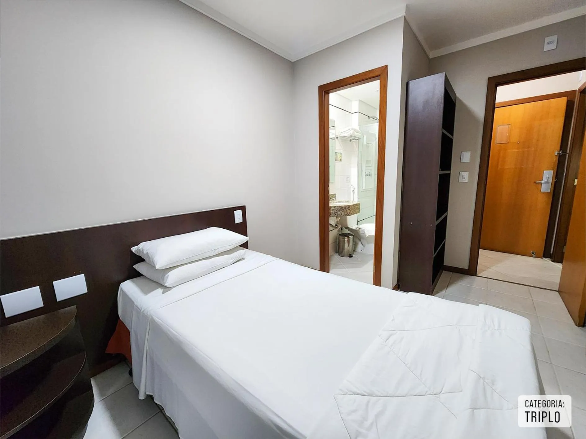 Bed in Triângulo Apart Hotel