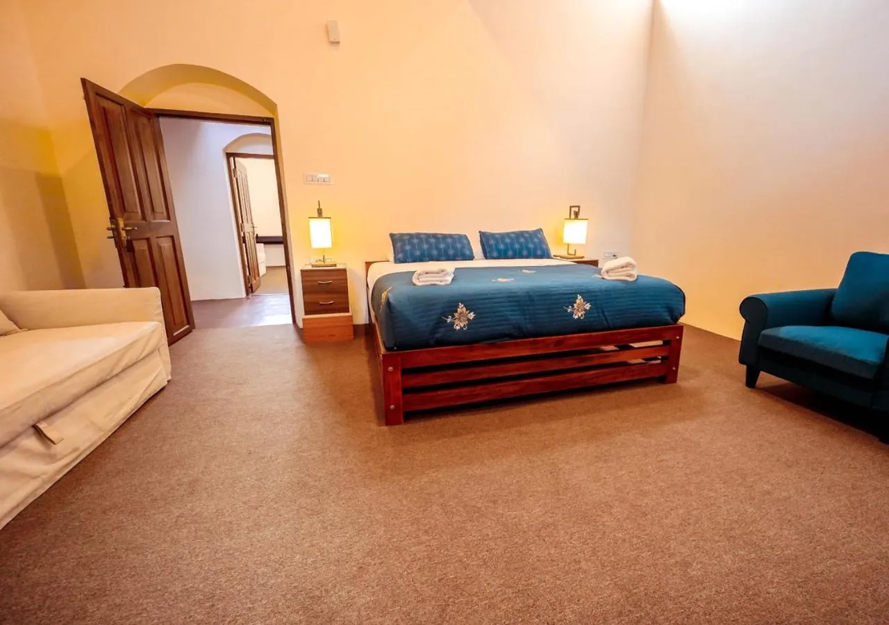 Bed in Lauriston Ooty Town Heritage Bungalow by VOYE HOMES