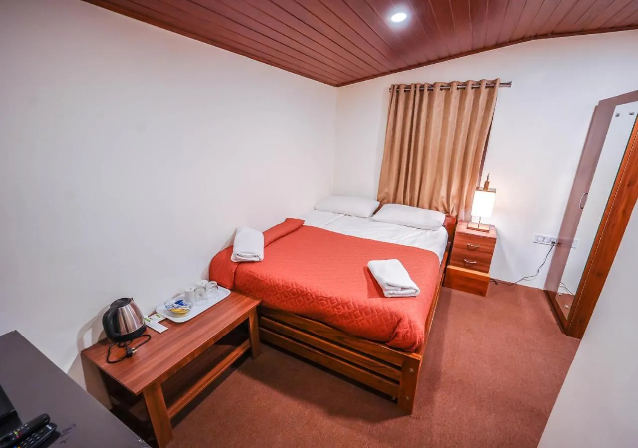 Bed in Lauriston Ooty Town Heritage Bungalow by VOYE HOMES