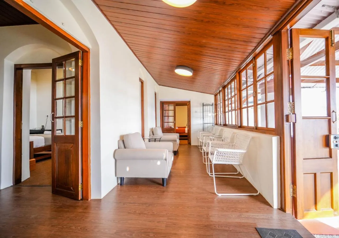 Living room in Lauriston Ooty Town Heritage Bungalow by VOYE HOMES