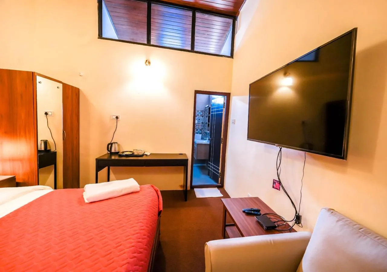 Bed in Lauriston Ooty Town Heritage Bungalow by VOYE HOMES