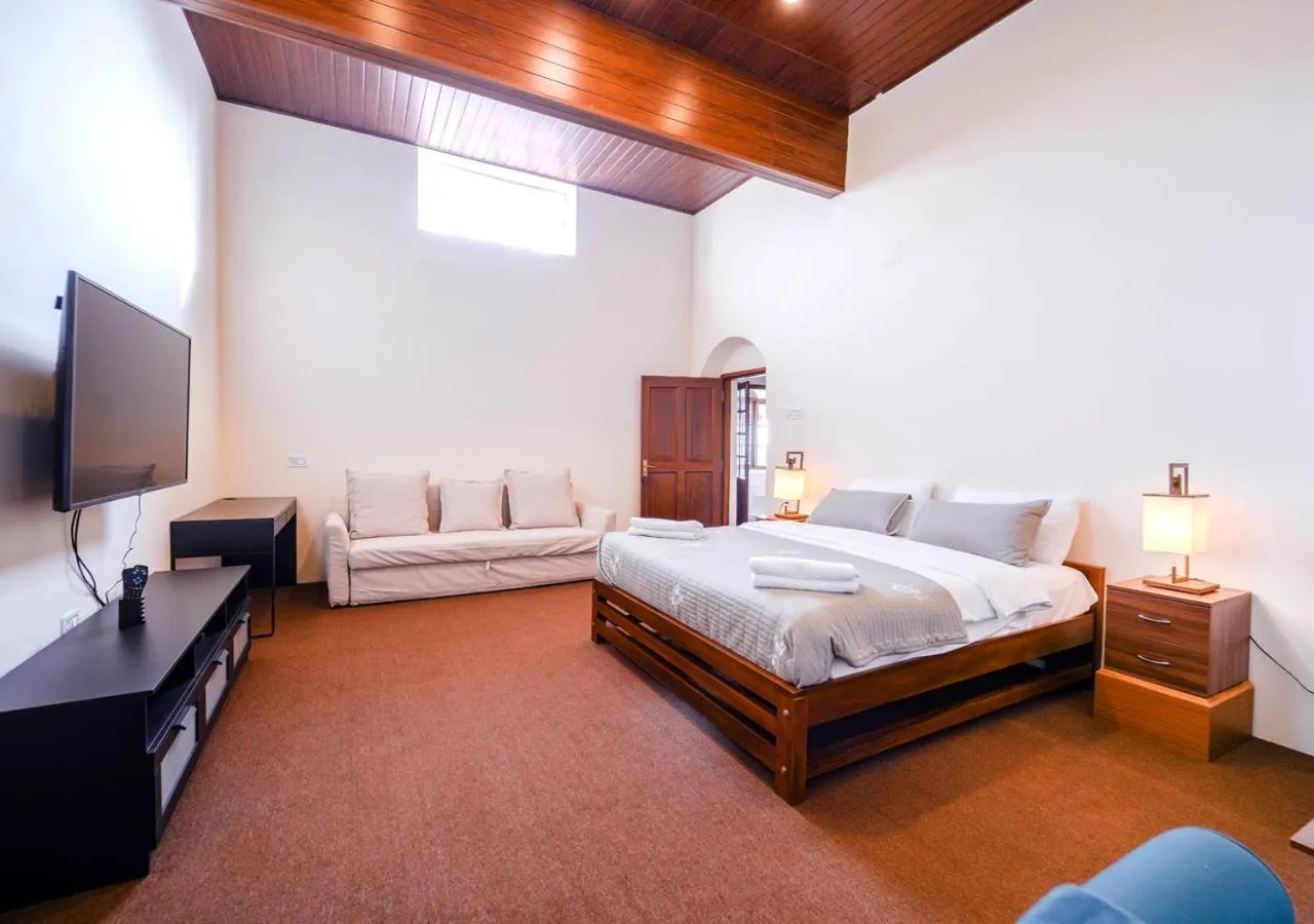 Bed in Lauriston Ooty Town Heritage Bungalow by VOYE HOMES