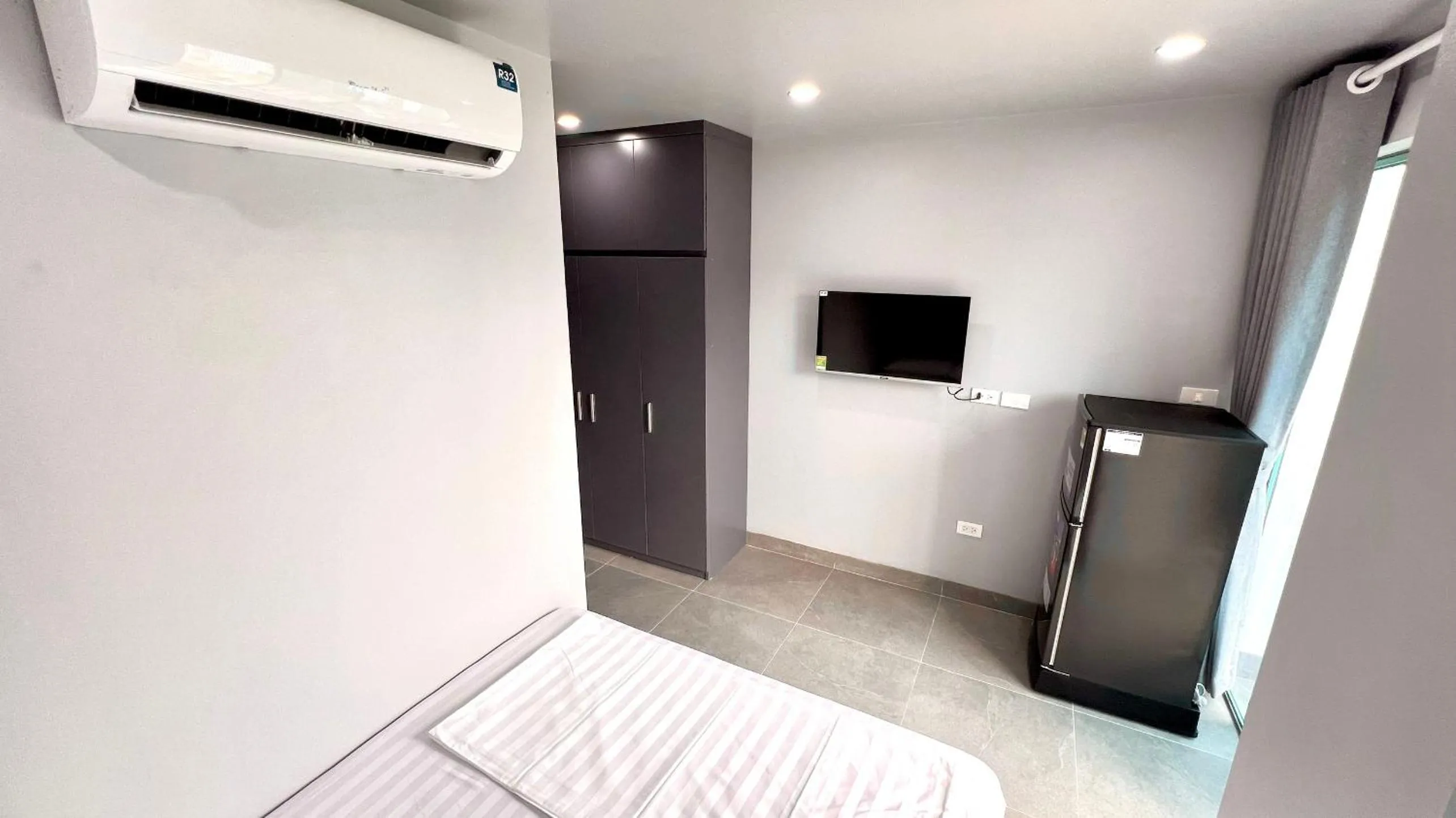 Communal lounge/ TV room, Bed in Era Apartment Cat Linh