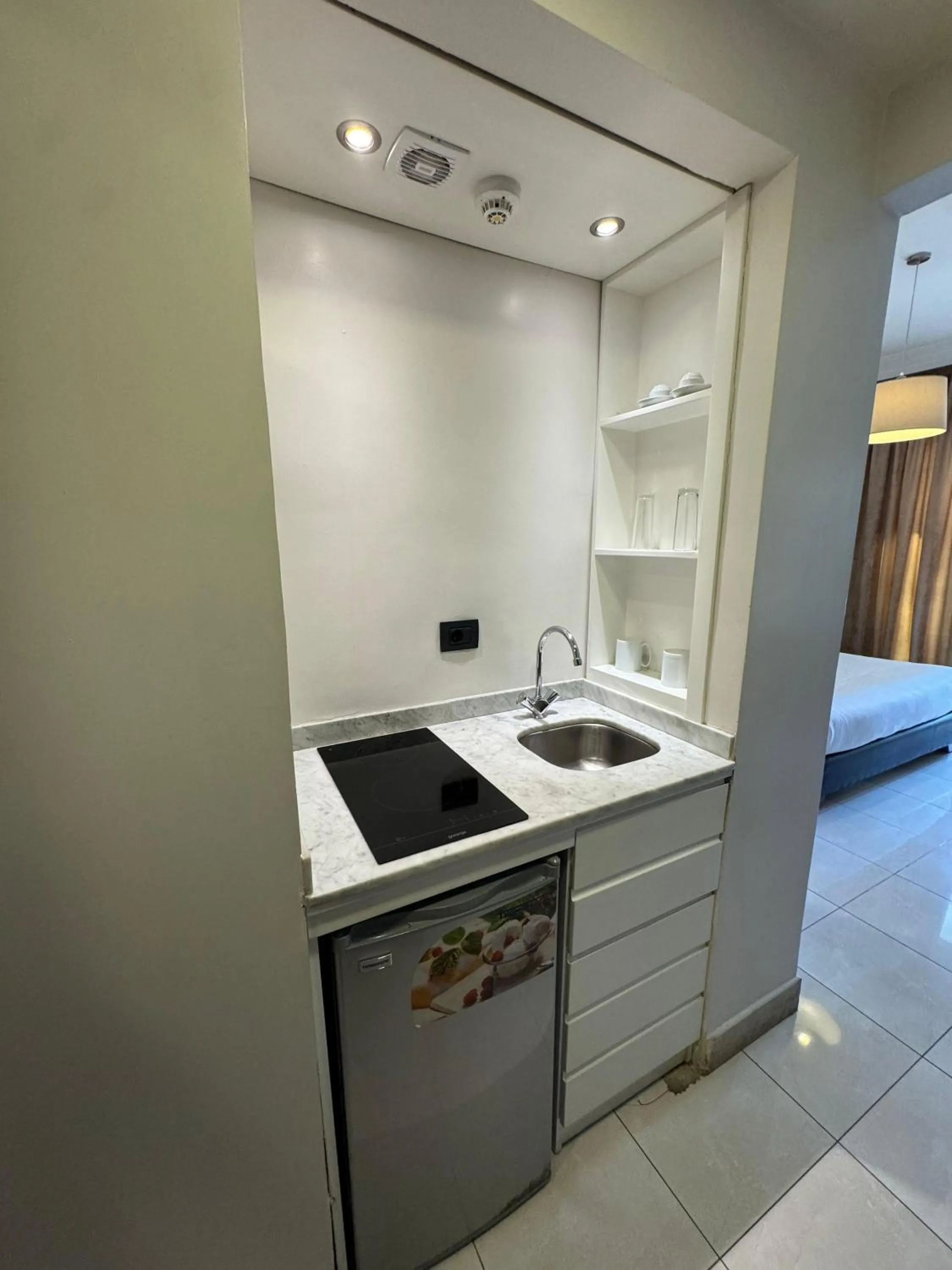 Kitchen or kitchenette in Ny Suites
