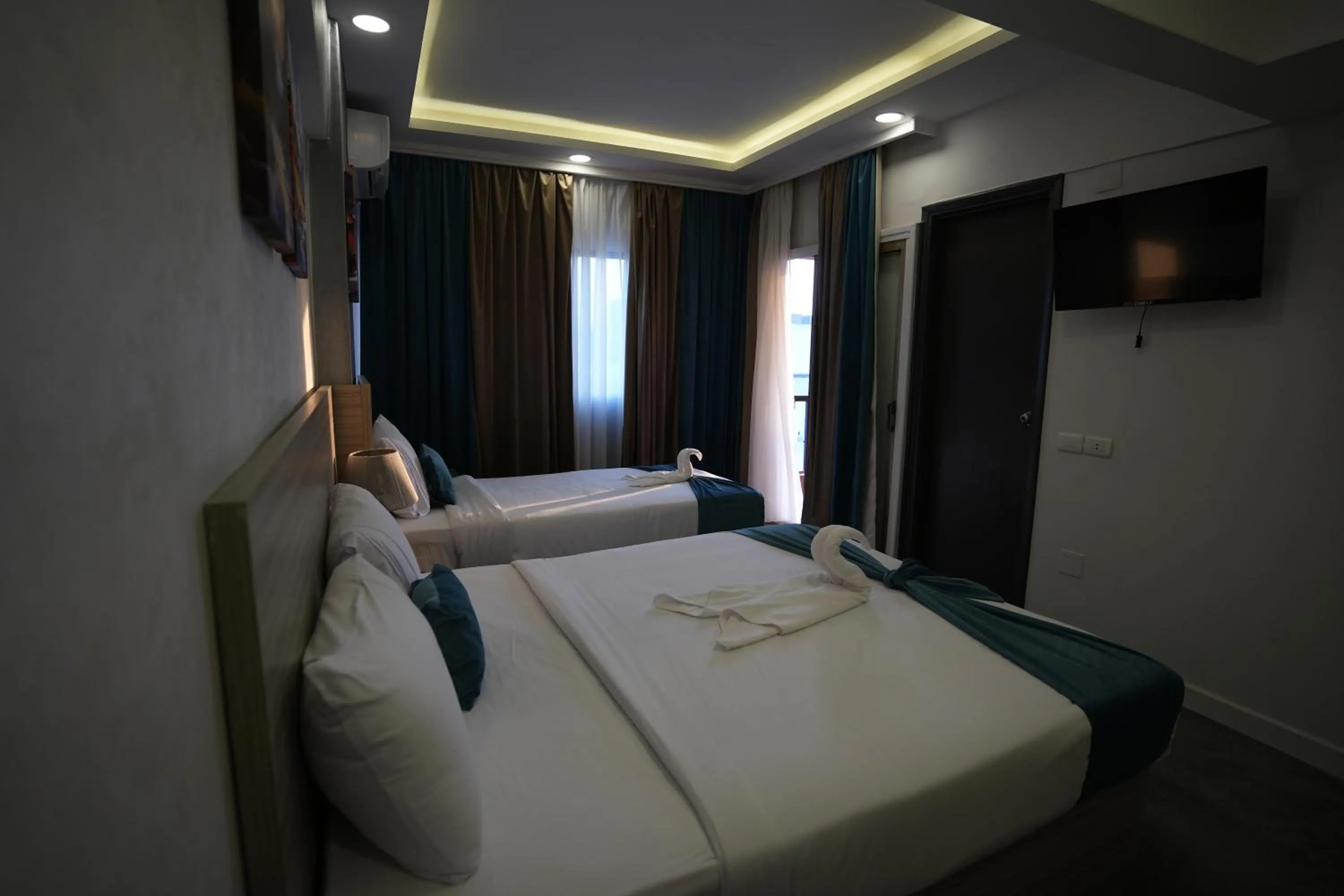 Bed in Mar Charbel Hotel Cairo