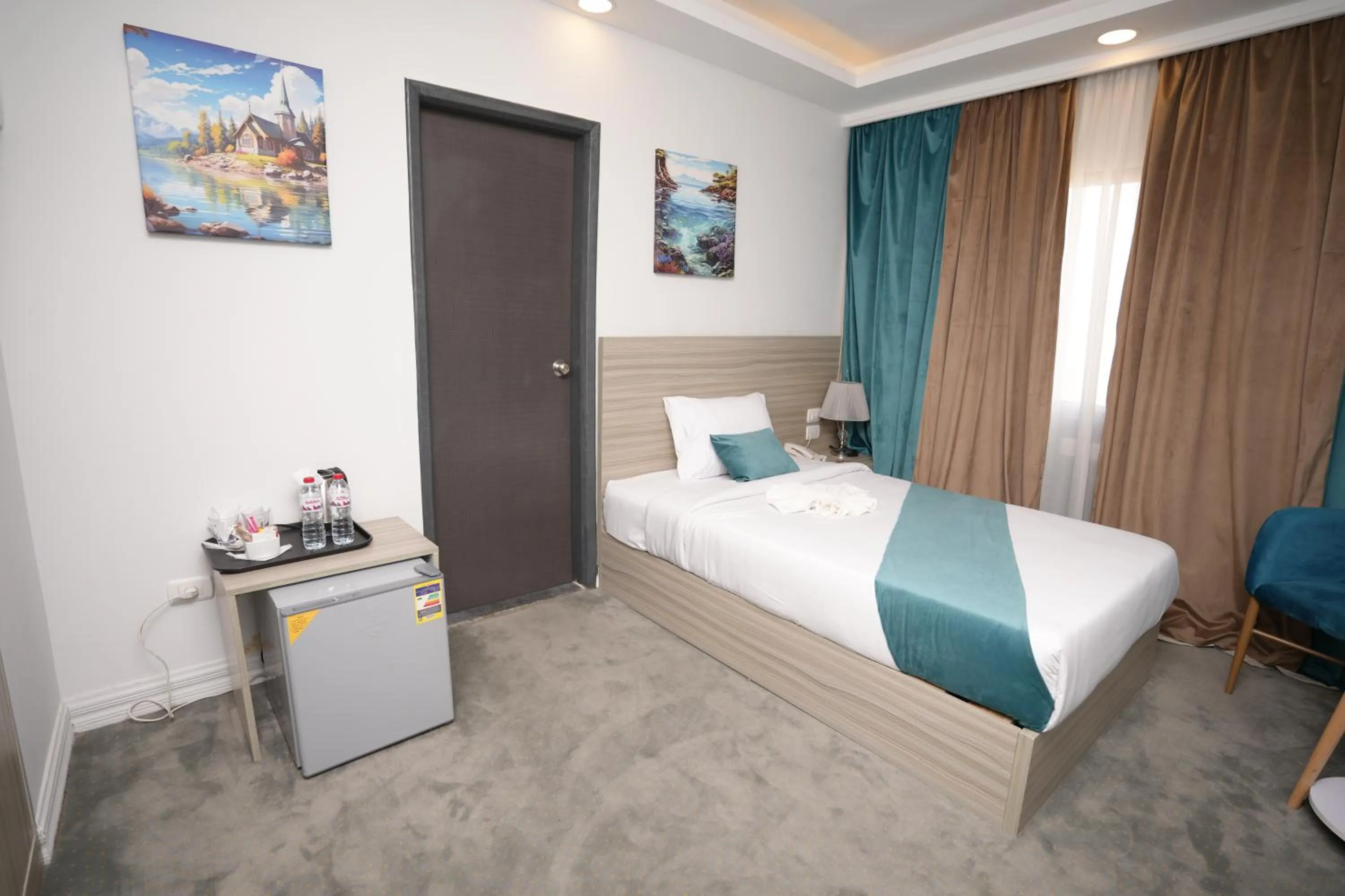 Bed in Mar Charbel Hotel Cairo