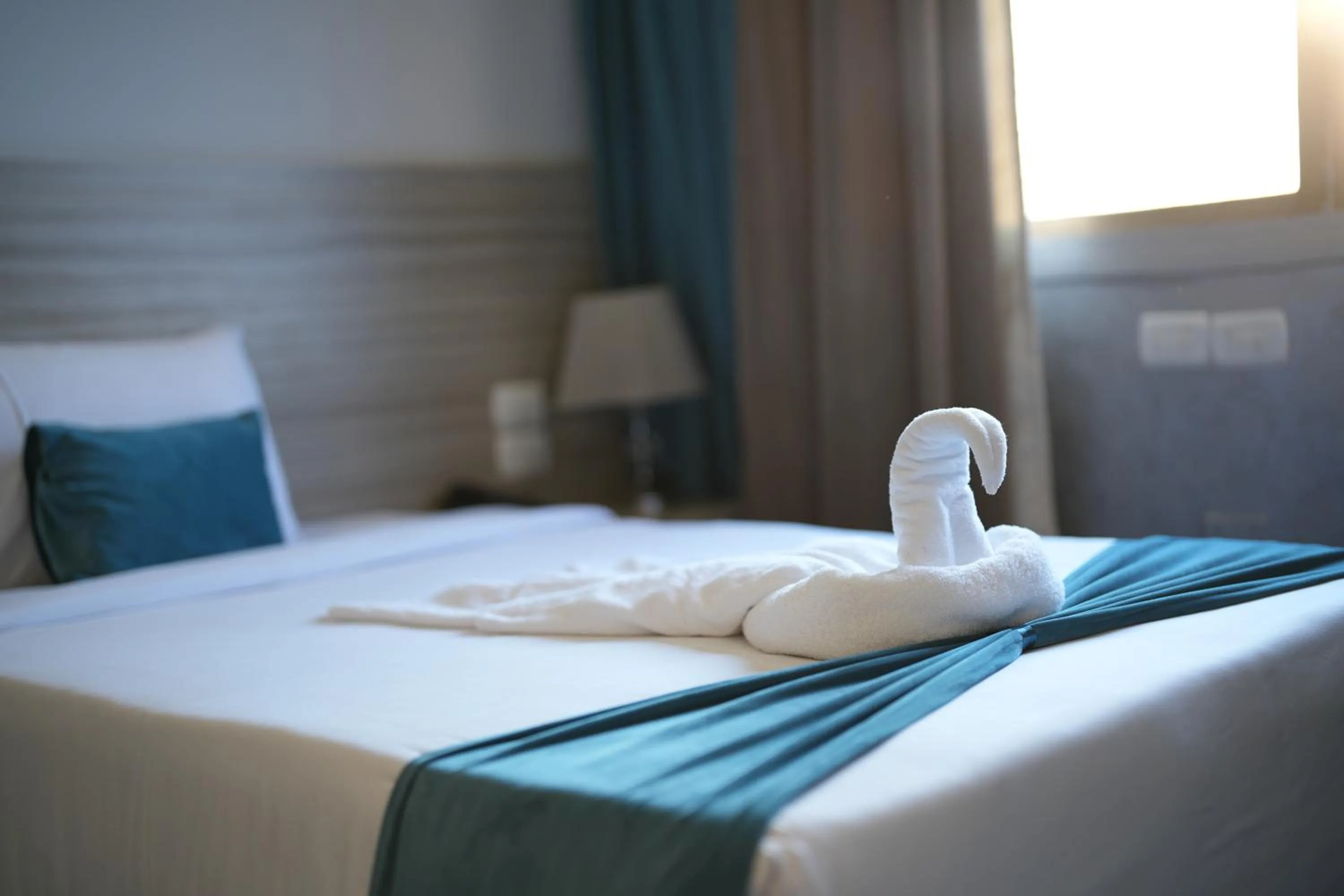 Bed in Mar Charbel Hotel Cairo