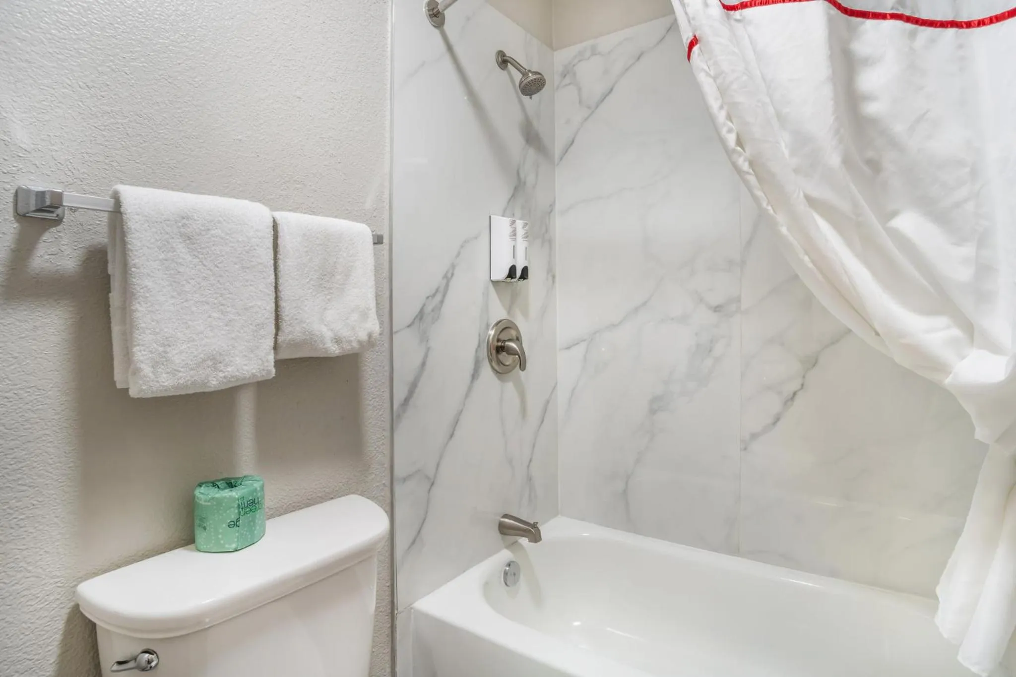 Bathroom in HomeTowne Studios by Red Roof Greenville