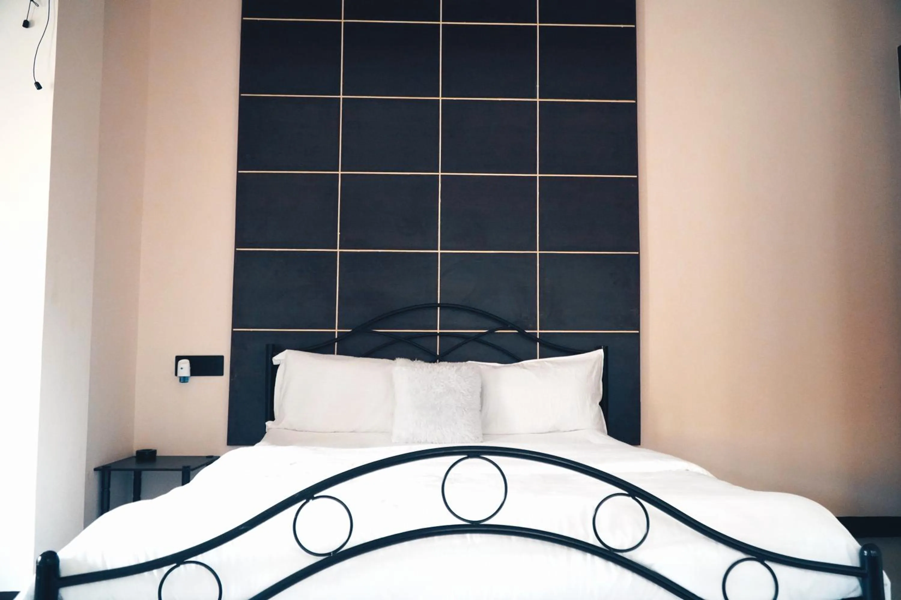 Bed in ROYALTY GLOBAL HOMESTAY