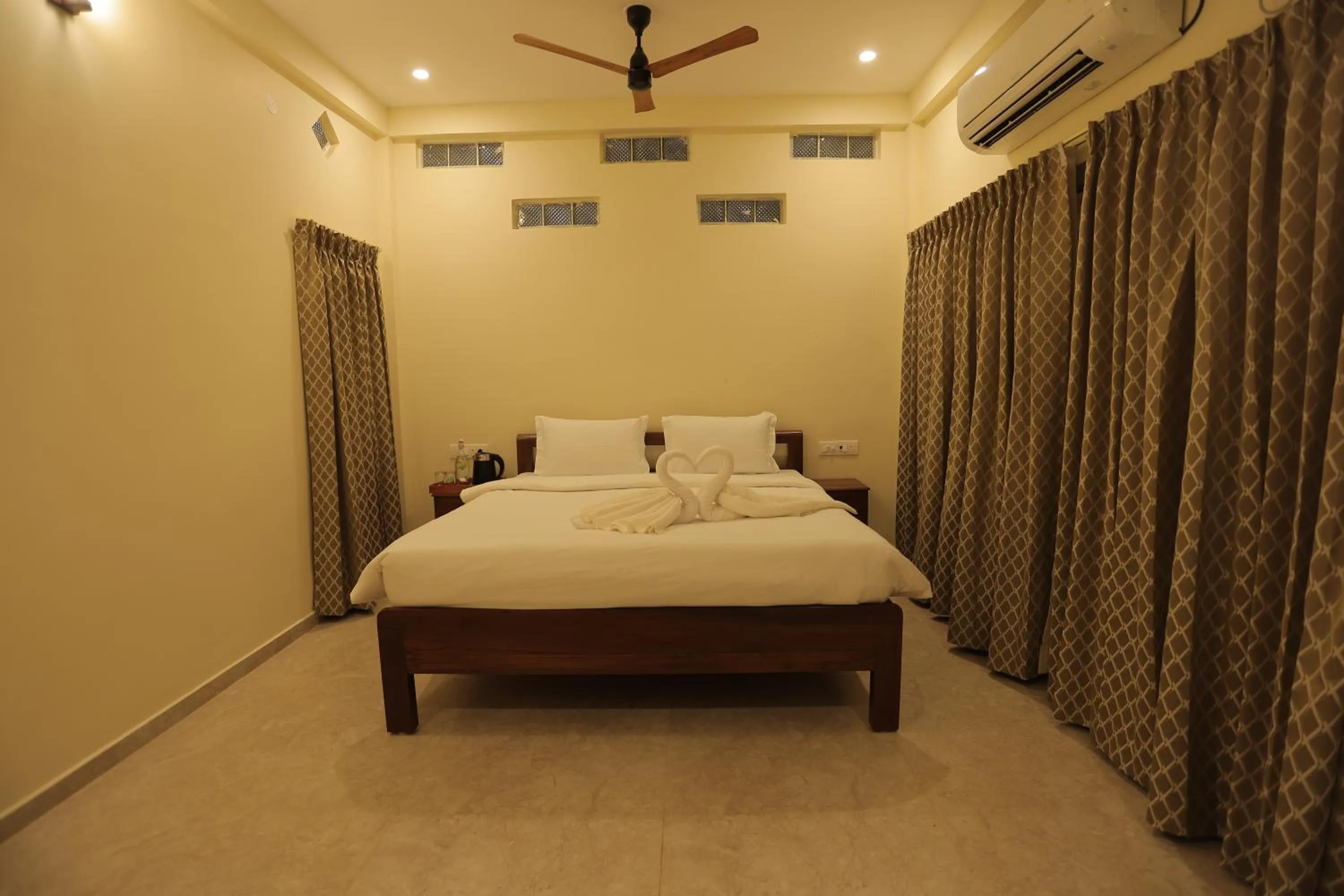 Bed in PALM PARADISE Beach Resort