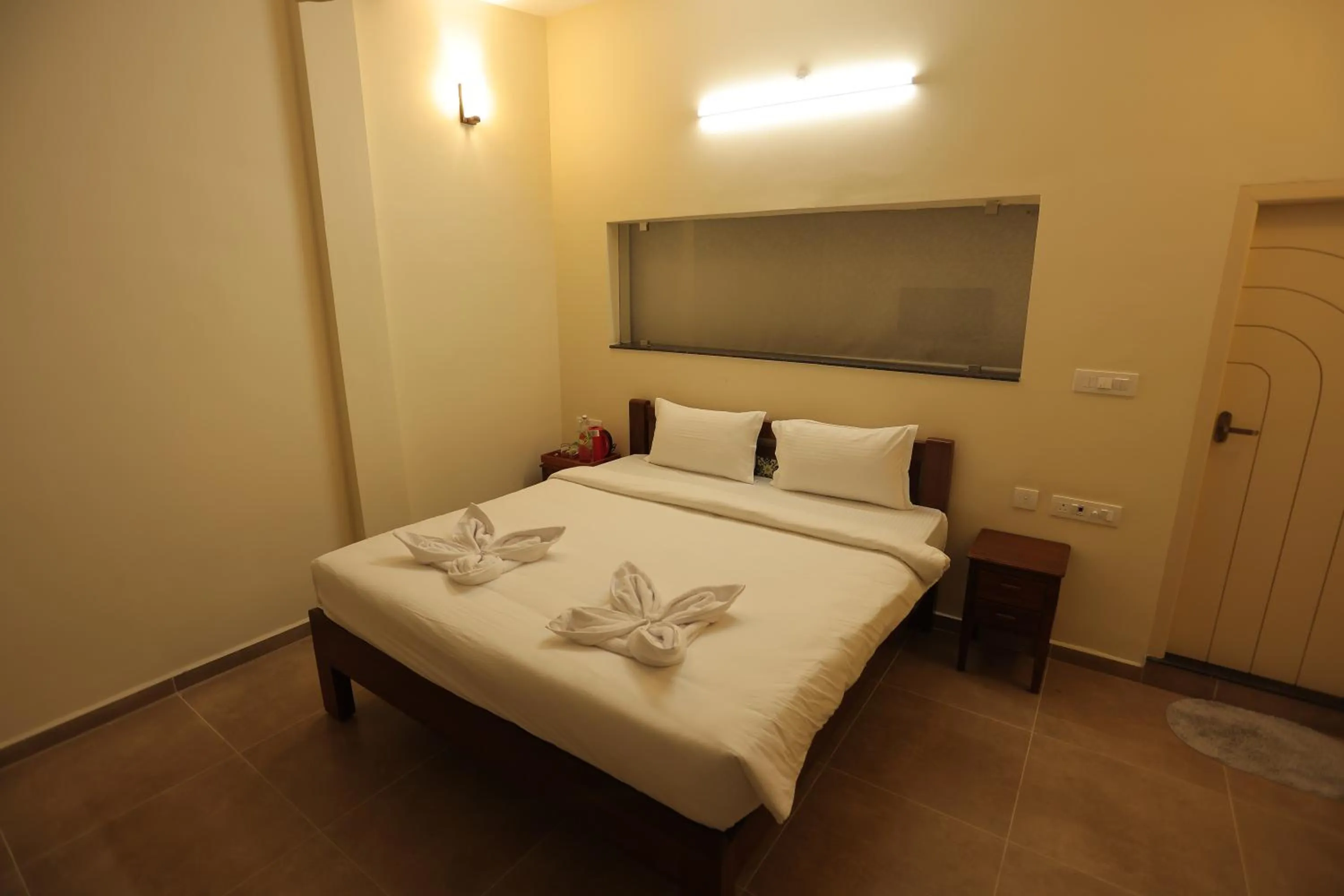 Bed in PALM PARADISE Beach Resort