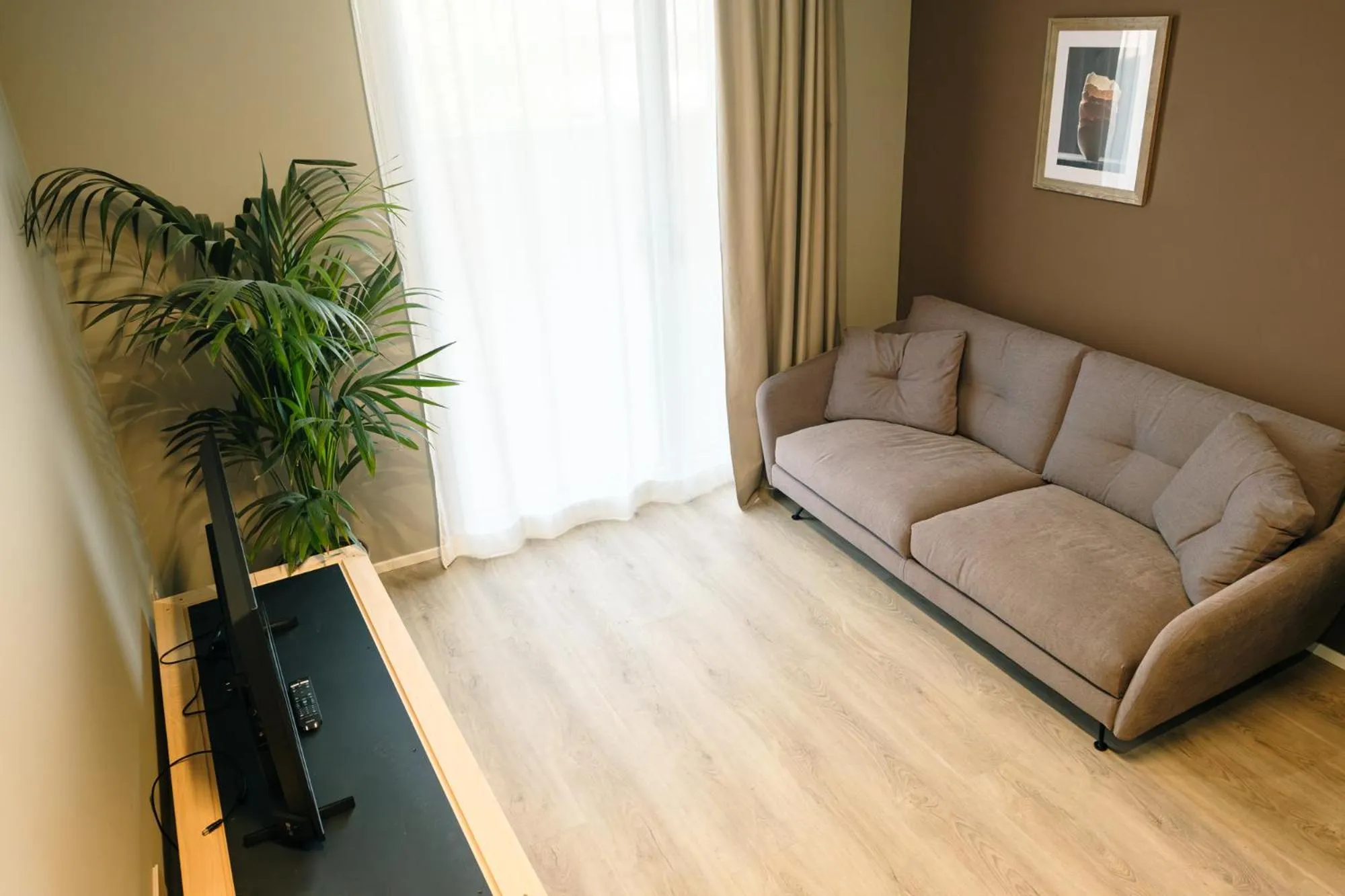 Living room in Camoma Aparthotel - Suites Apartments