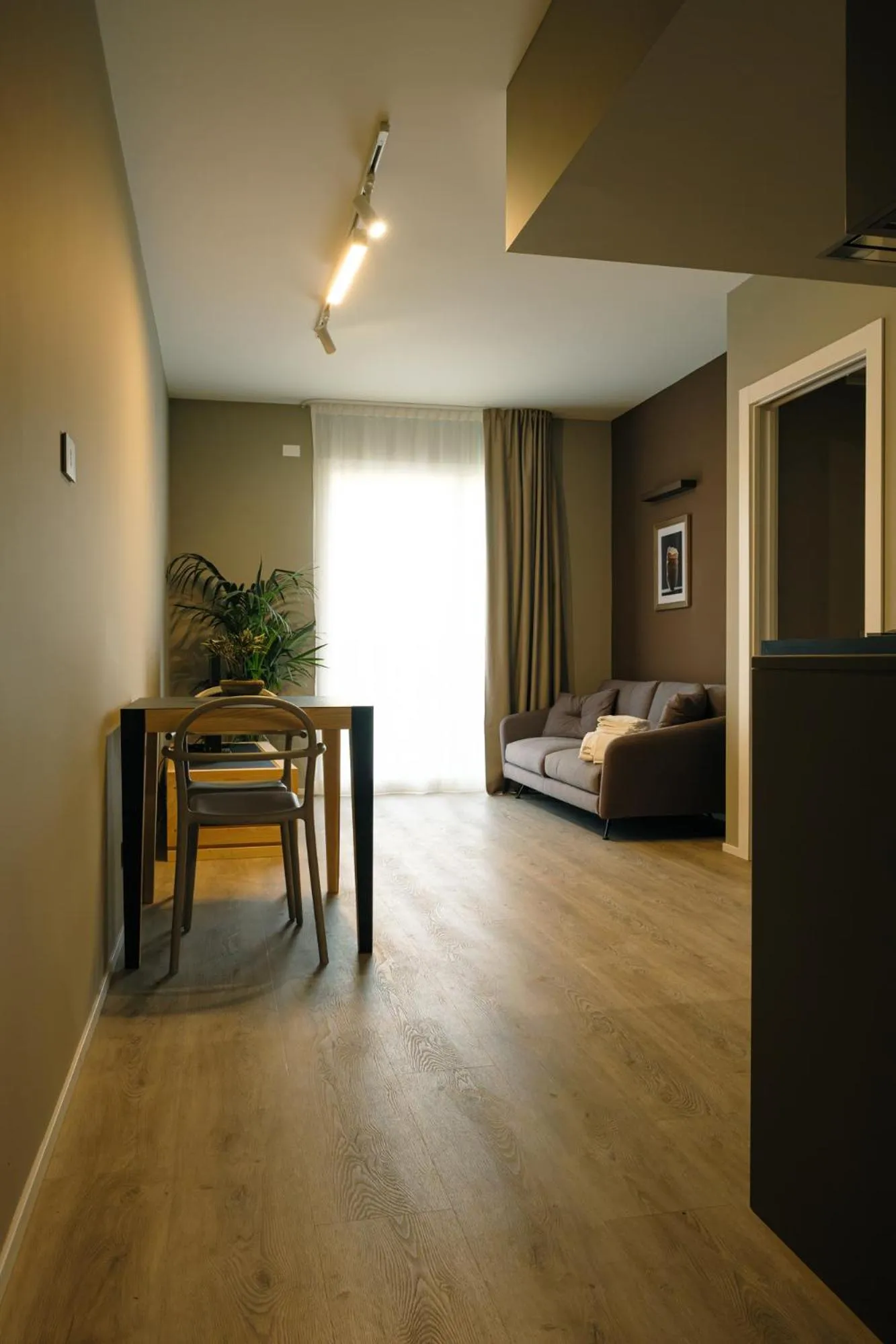 Living room, Bed in Camoma Aparthotel - Suites Apartments