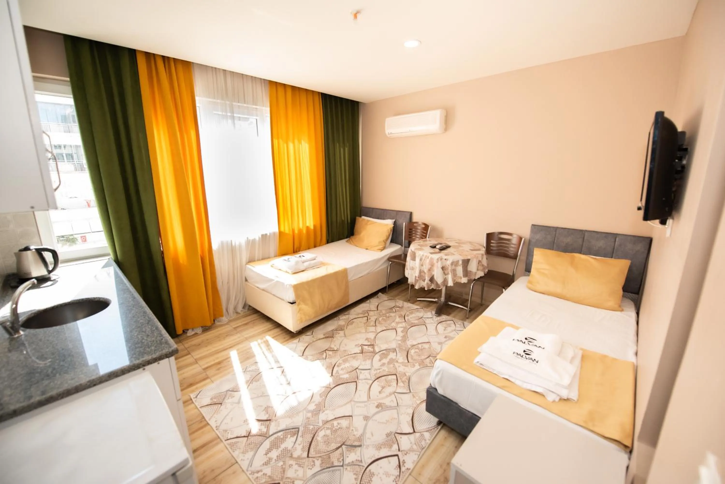 Bed, Seating Area in Palvan Hotel