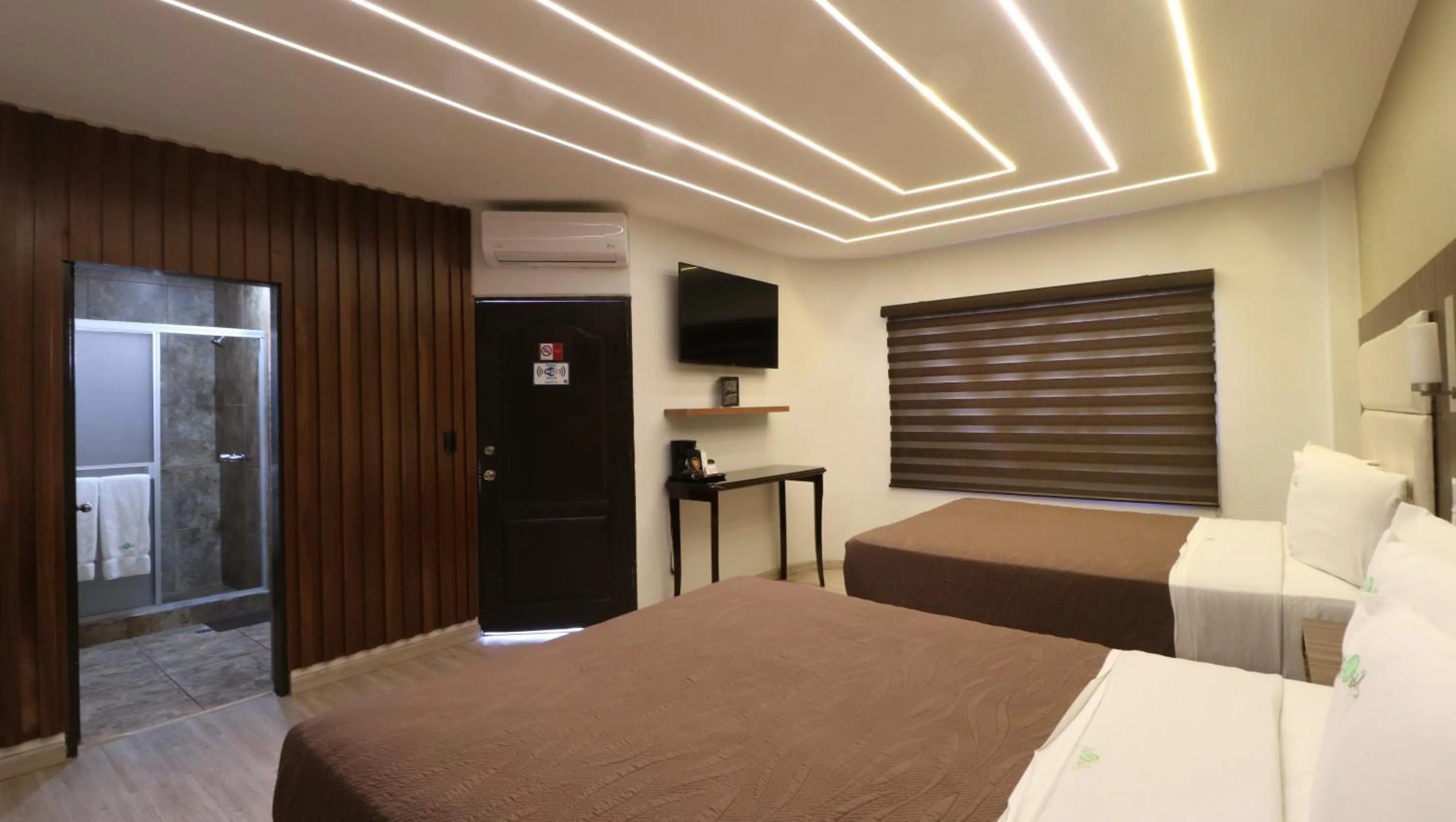 Bed in HOTEL BUGAMBILIAS