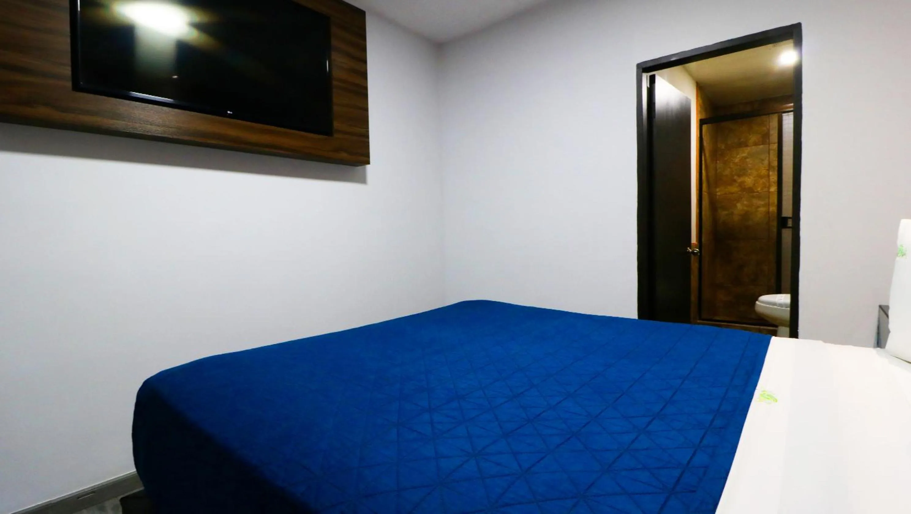 Bed in HOTEL BUGAMBILIAS