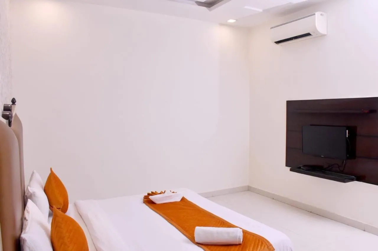 Communal lounge/ TV room in Nirmal Hotel And Resort