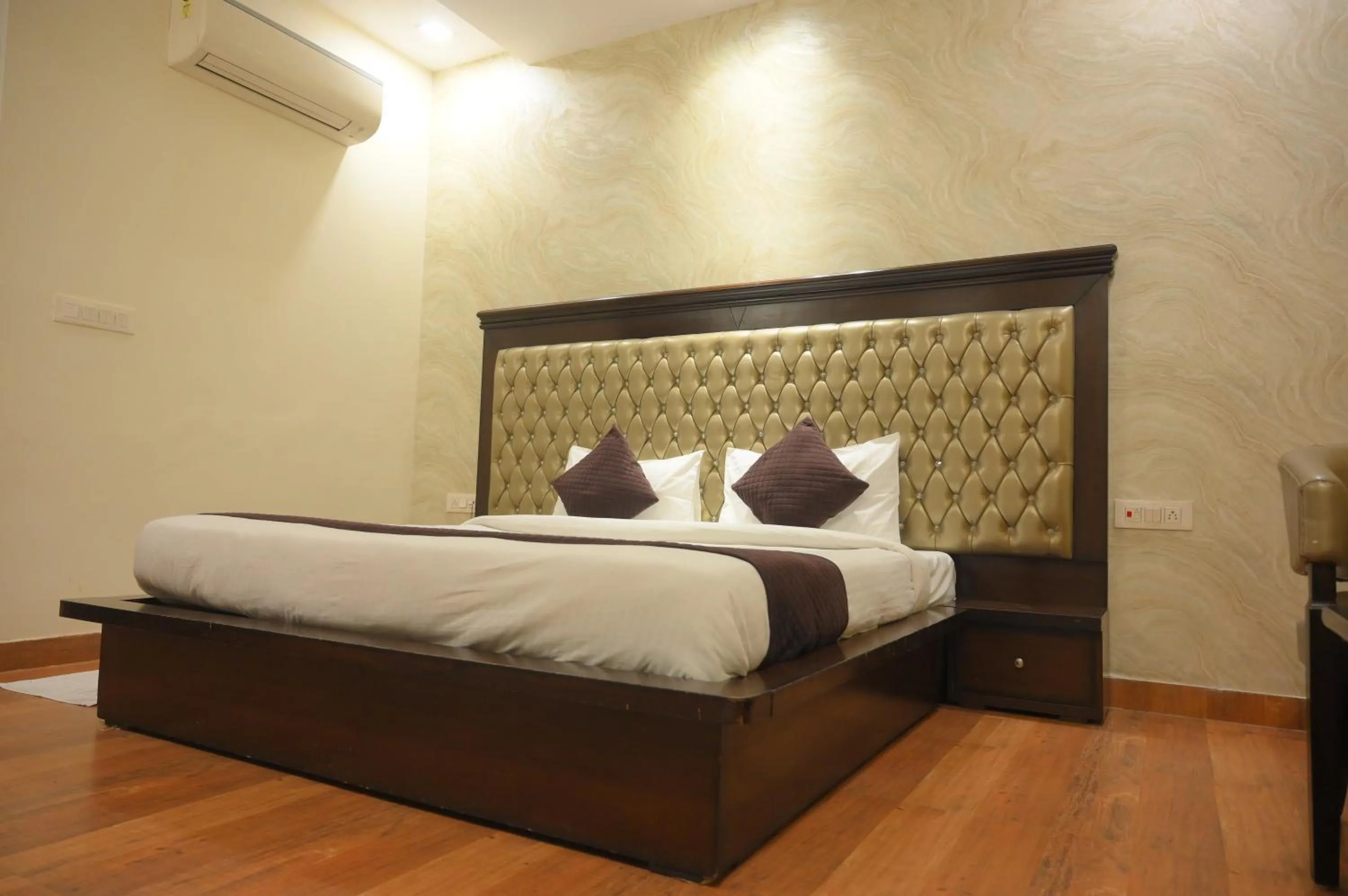 Bed in Nirmal Hotel And Resort