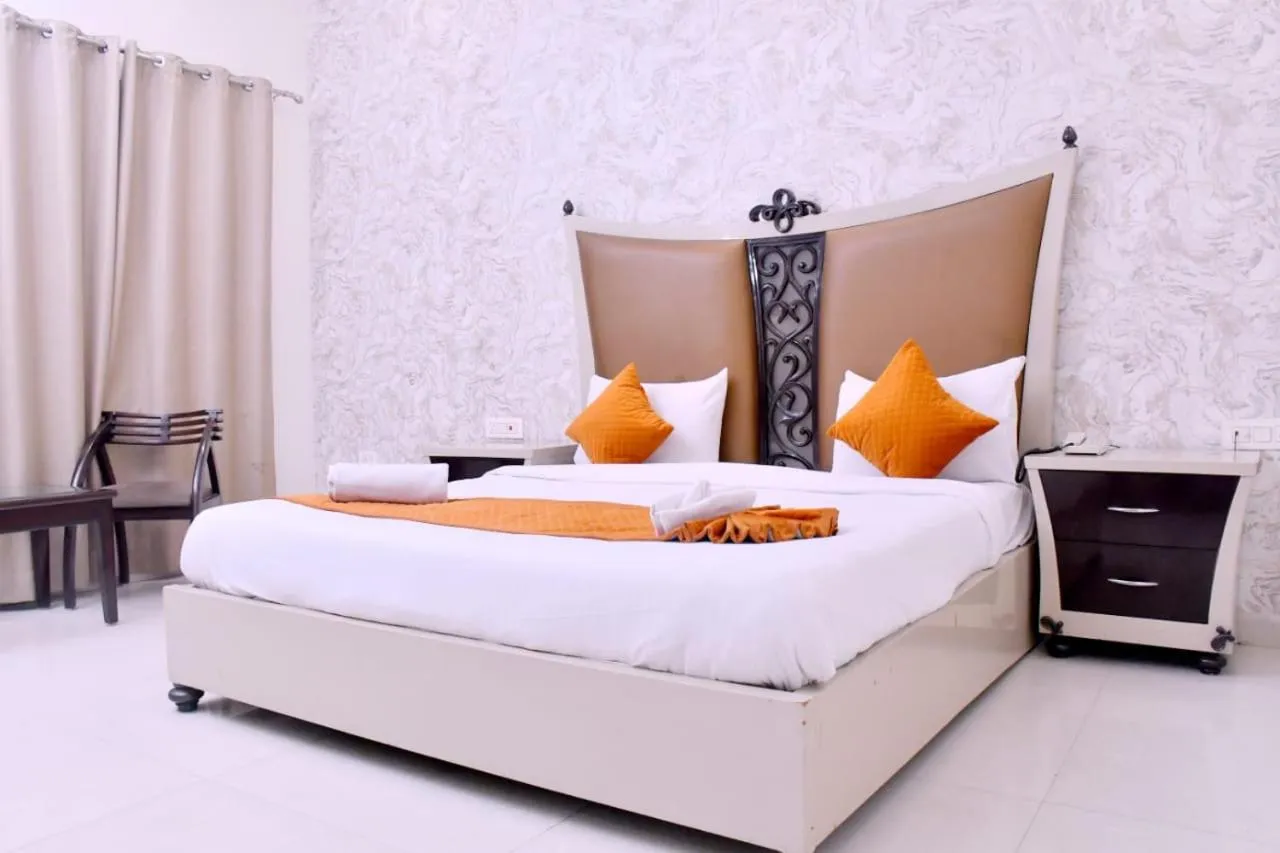 Bed in Nirmal Hotel And Resort