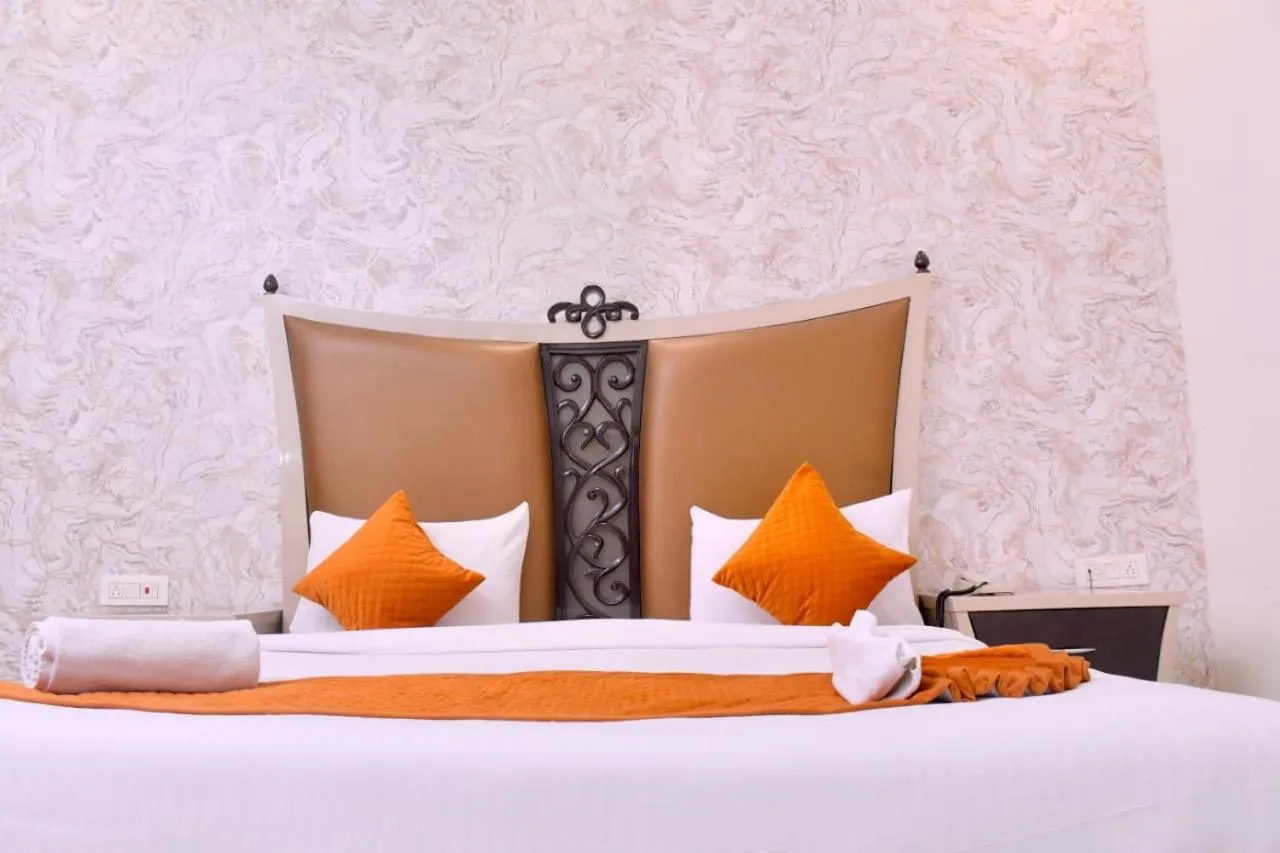Bed in Nirmal Hotel And Resort