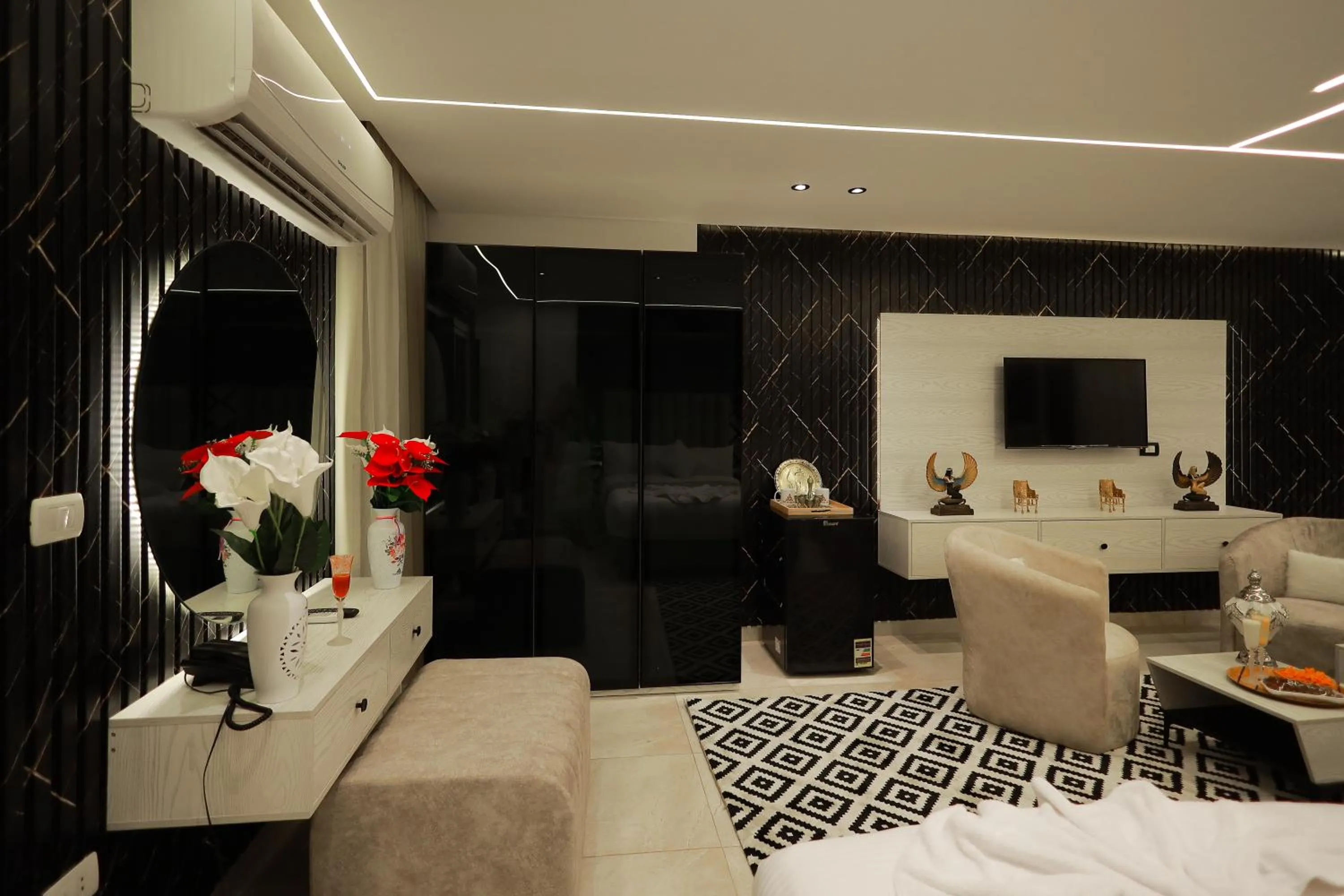 Seating area, Bed in The Muse Pyramids INN