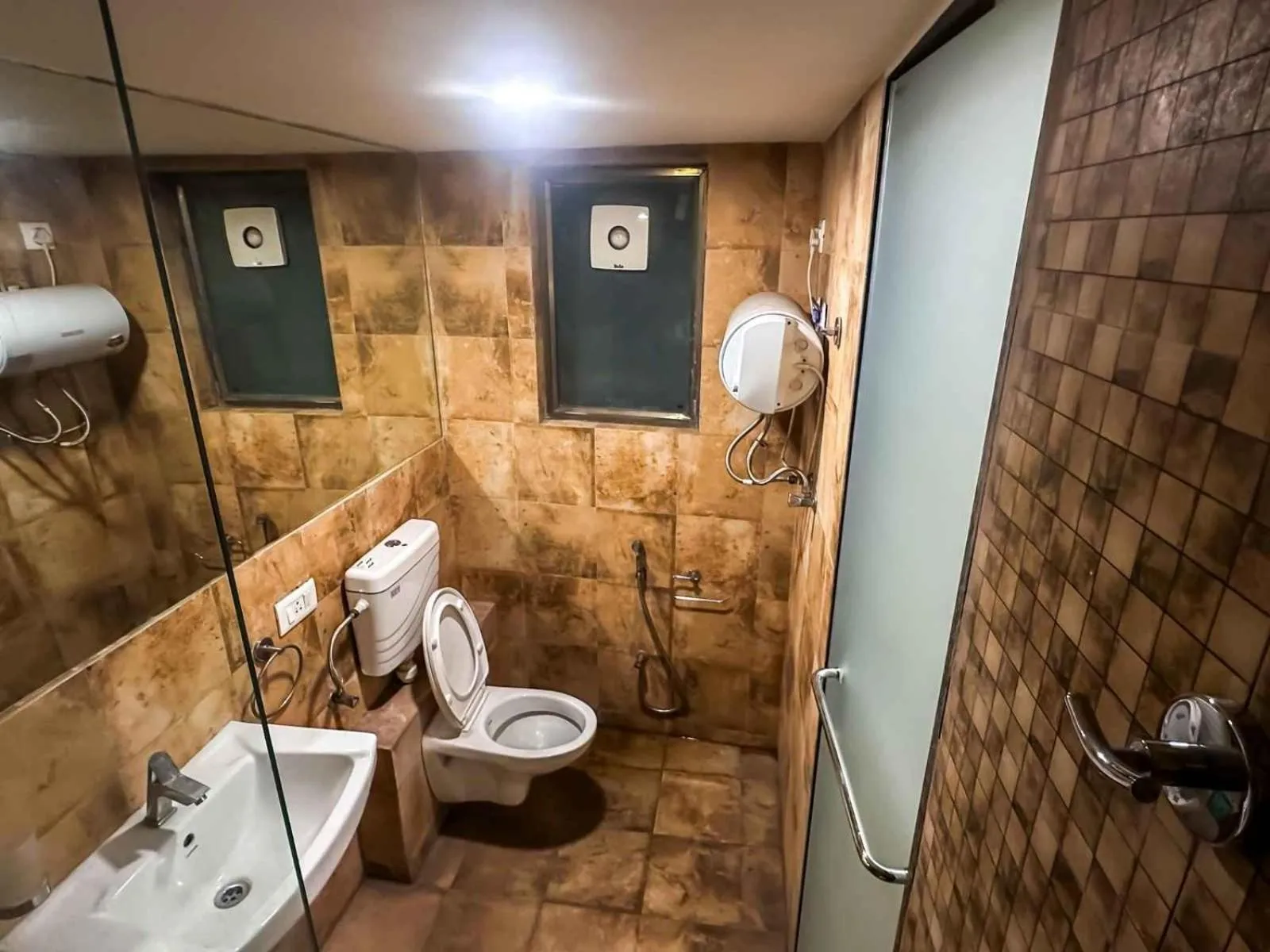 Bathroom in Ambition studio apartment at rajhans belliza