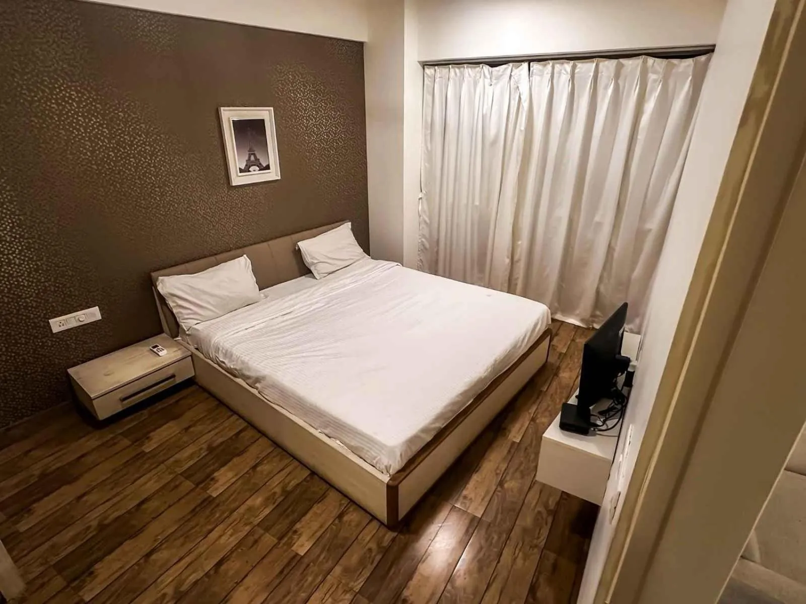 Bed in Ambition studio apartment at rajhans belliza