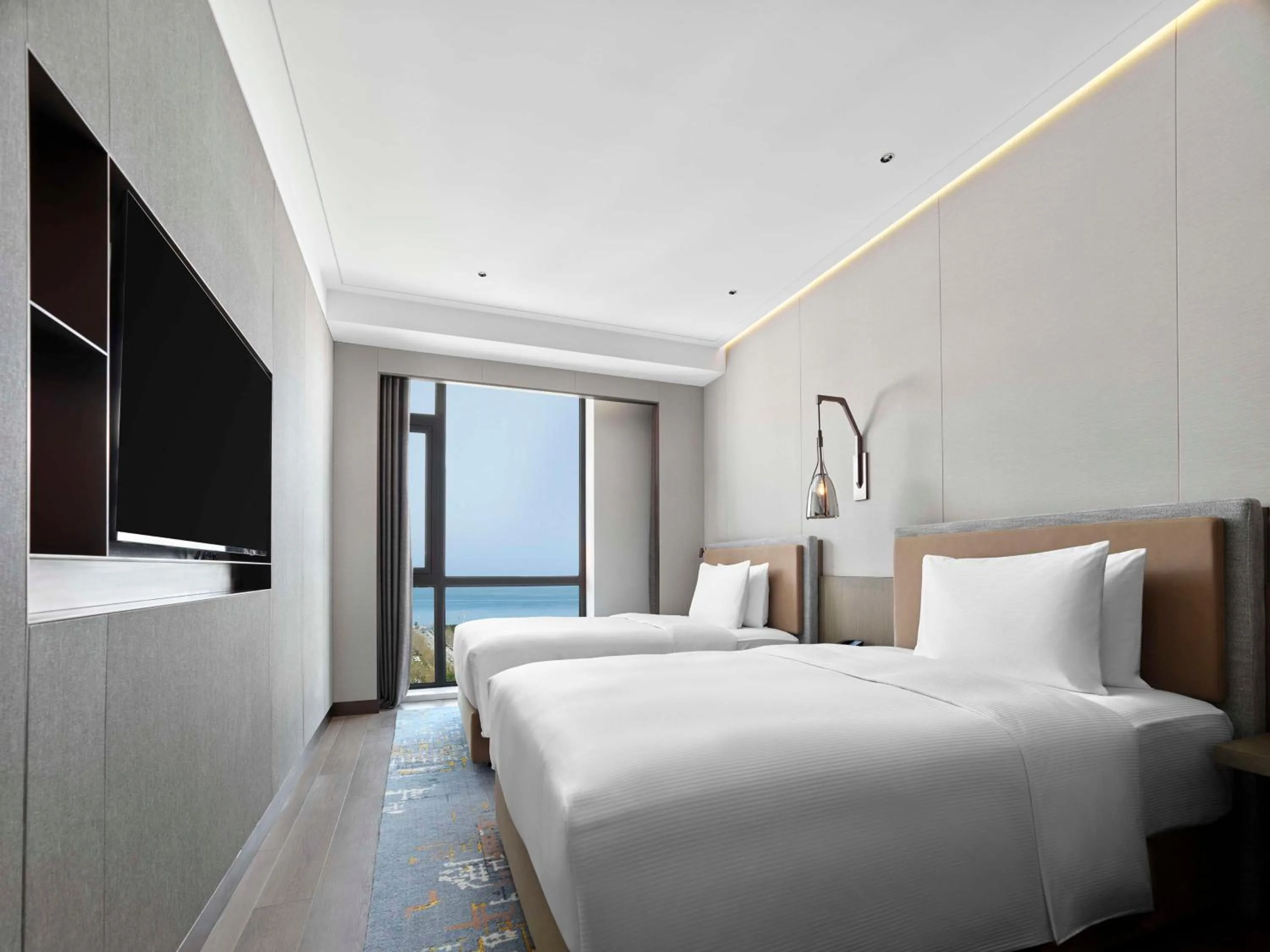 Bed in Doubletree By Hilton Yantai Golden Coast Hotel & Suites
