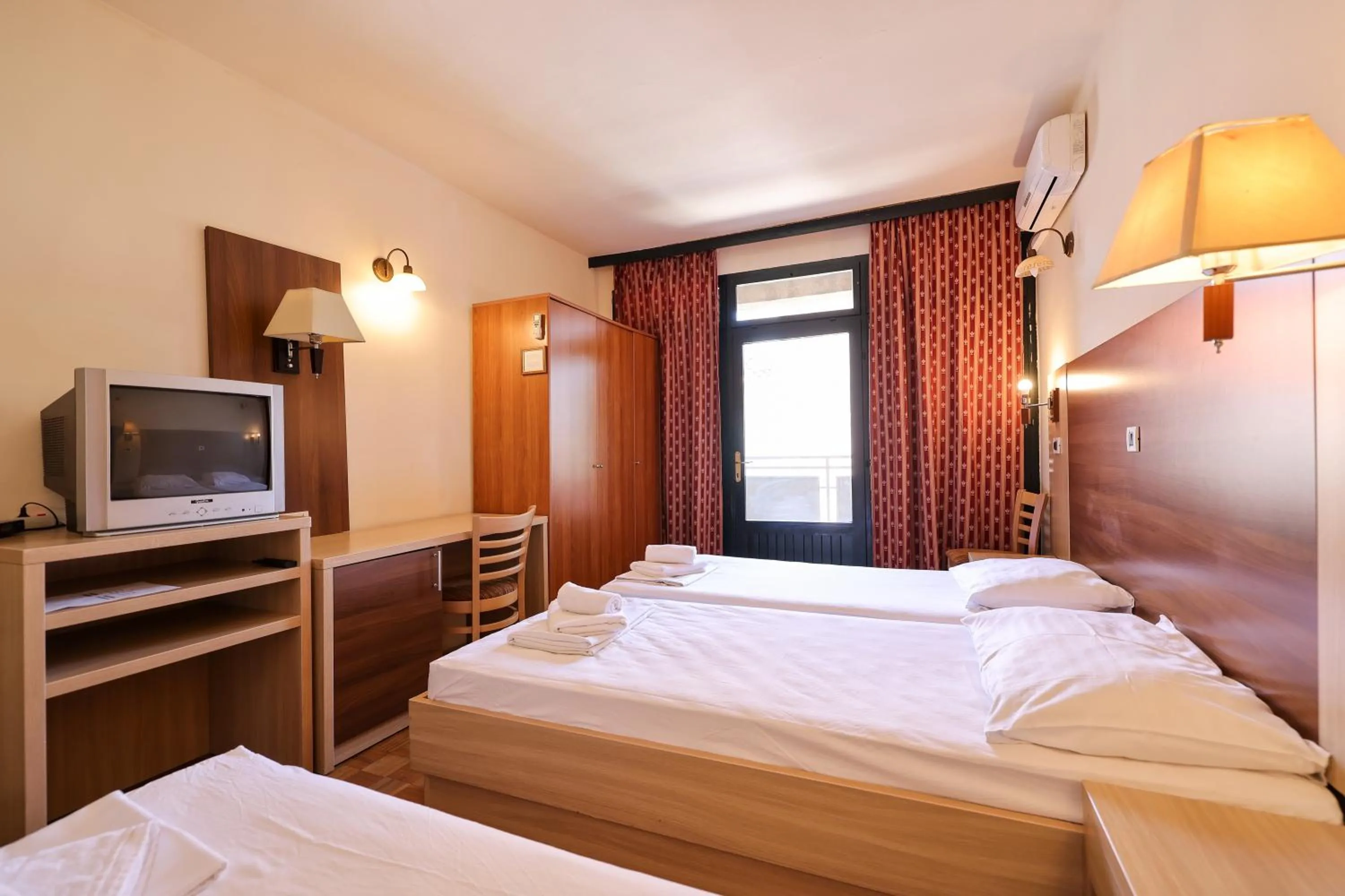 Bed in Tribunia Beach Hotel