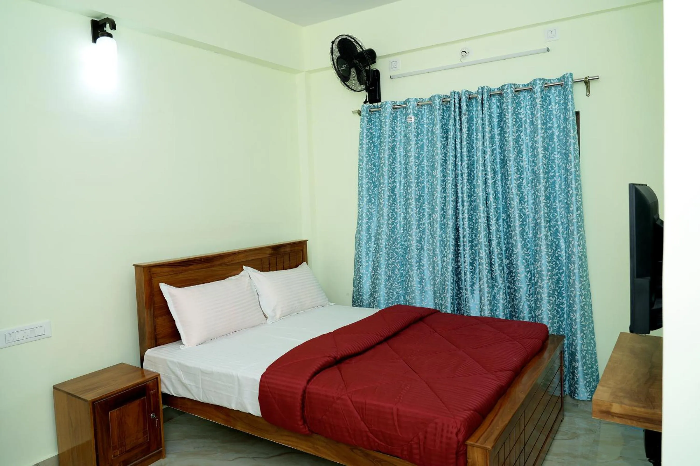 Bed in HILL PALACE RESIDENCY COORG