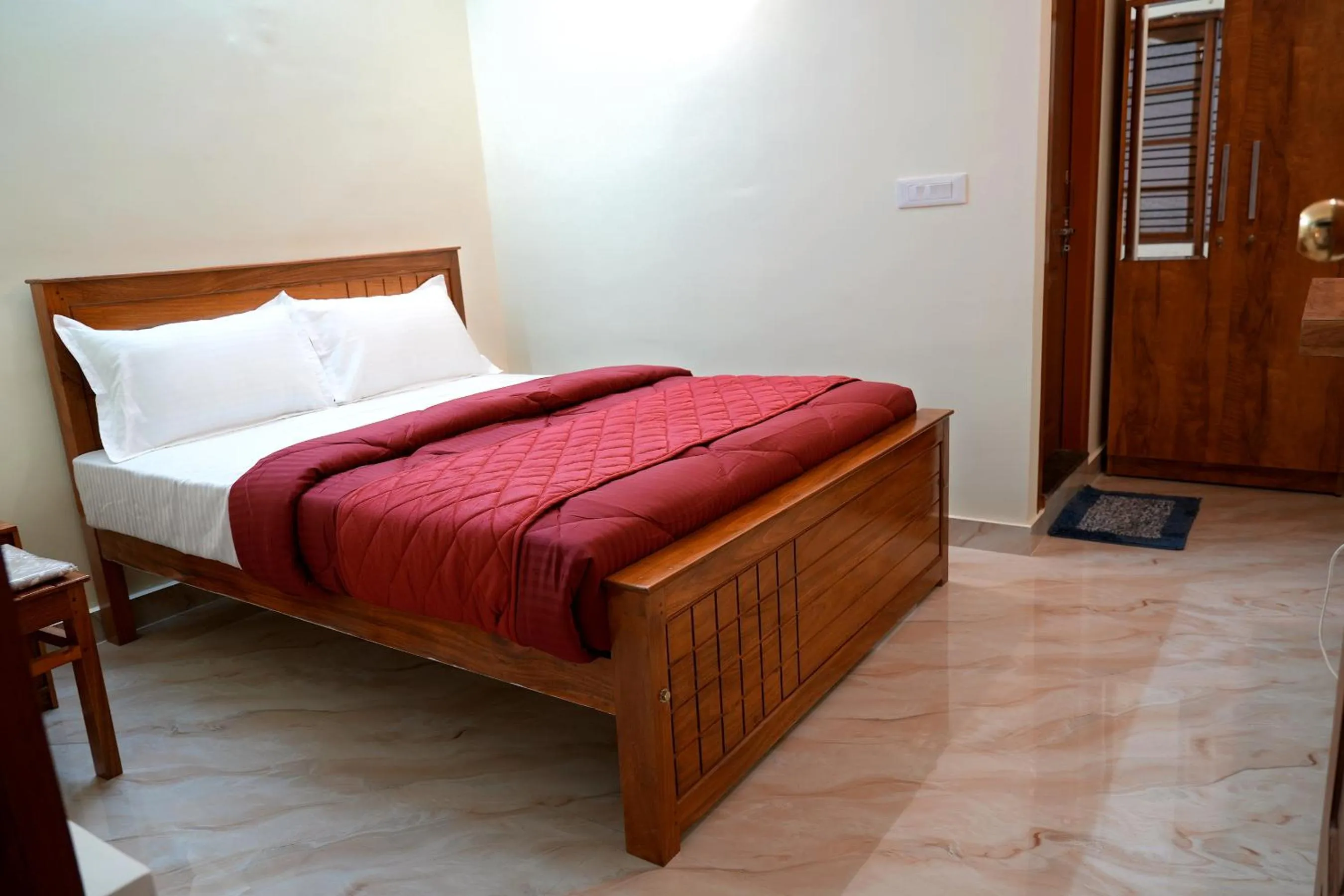 Bed in HILL PALACE RESIDENCY COORG