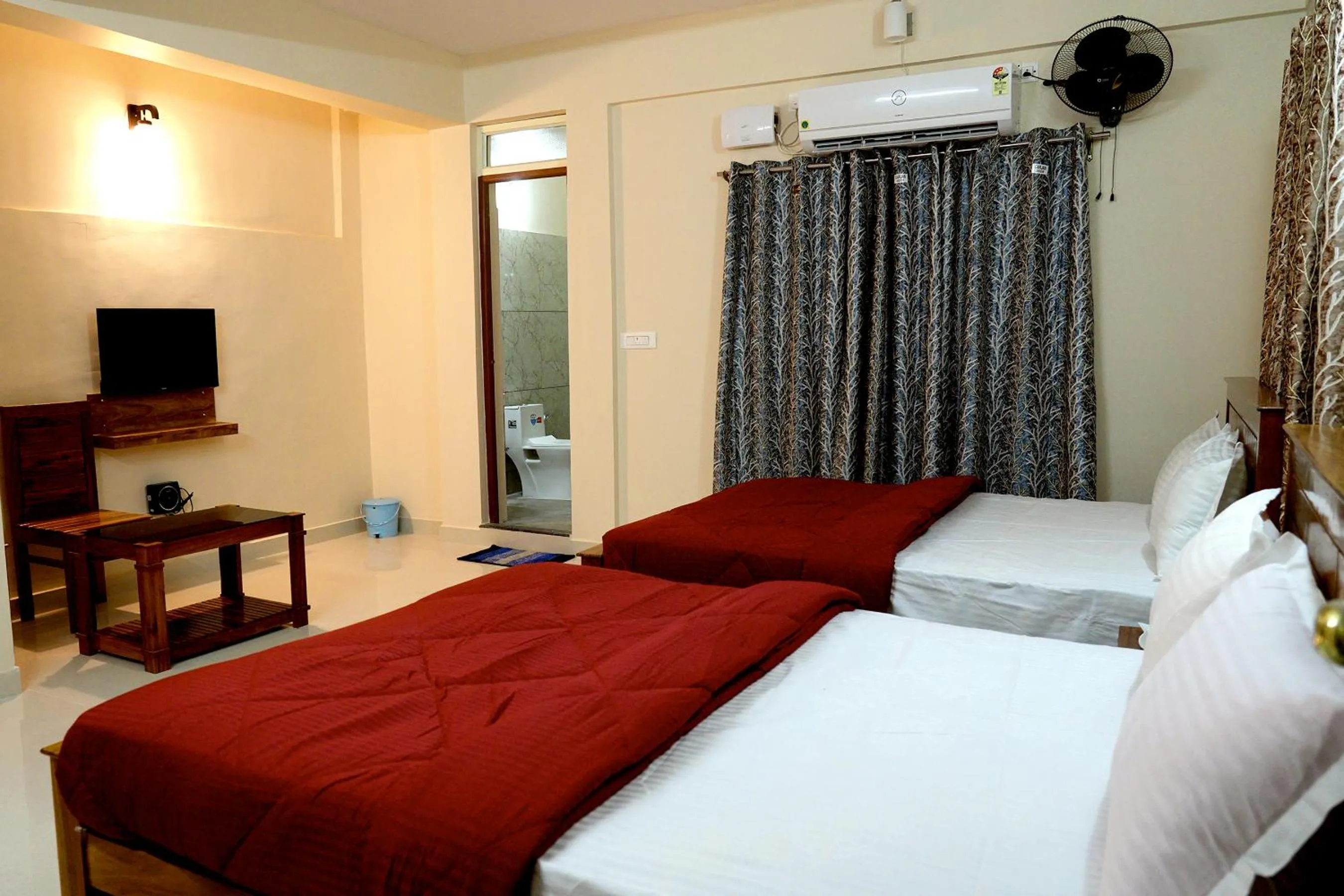 Communal lounge/ TV room, Bed in HILL PALACE RESIDENCY COORG